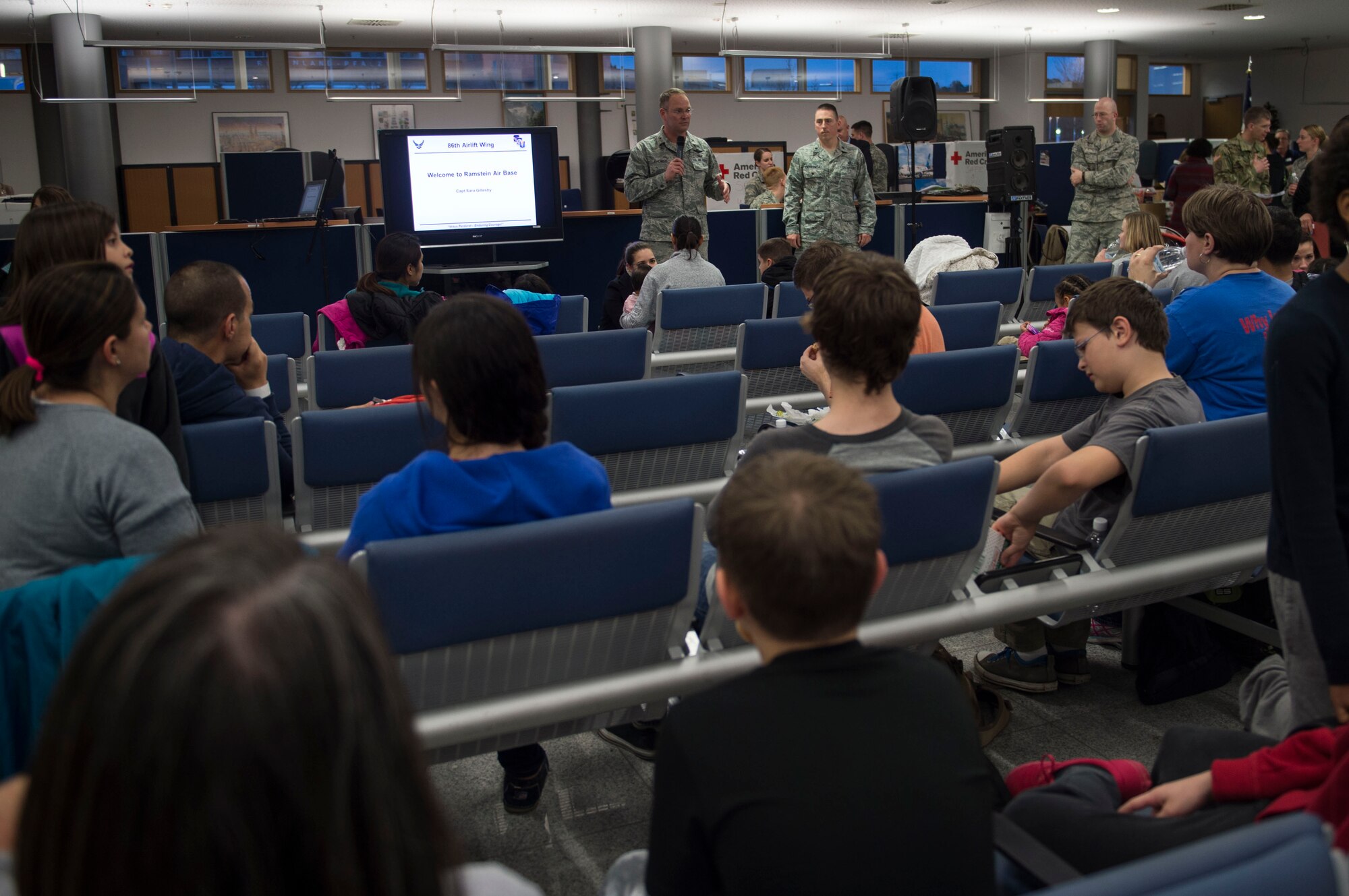 Brig. Gen. Jon T. Thomas, 86th Airlift Wing commander, welcomes the first group of Air Force families to Ramstein Air Base, Germany, after the ordered departure of dependents of service members and Defense Department civilian personnel currently stationed in Turkey, March 30, 2016. As dependents depart Turkey, Ramstein AB has been designated as a 'transition location' for families to await travel to their subsequent duty locations. (U.S. Air Force photo/Staff Sgt. Sara Keller)