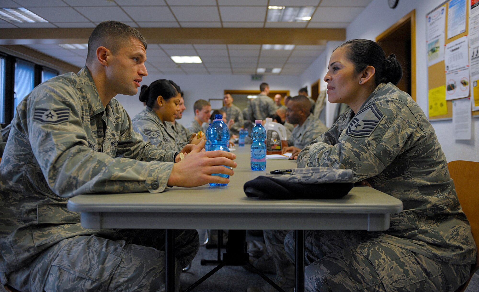 Staff Sgt. Dustin Trimble, U.S. Air Forces in Europe Band regional band member, talks with Senior Master Sgt. Roelma Wood, Air Force Installation Mission Support Center Detachment 4 major command functional manager for security forces, during a speed mentoring session March 28, 2016, at Ramstein Air Base, Germany. Wood, who is a chief master sergeant-select, along with other senior NCOs, officers and retirees volunteered to mentor nearly 20 Airmen during the event hosted by the Total Force Development Council and Ramstein Air Force Association Chapter 507. (U.S. Air Force photo/Staff Sgt. Timothy Moore)