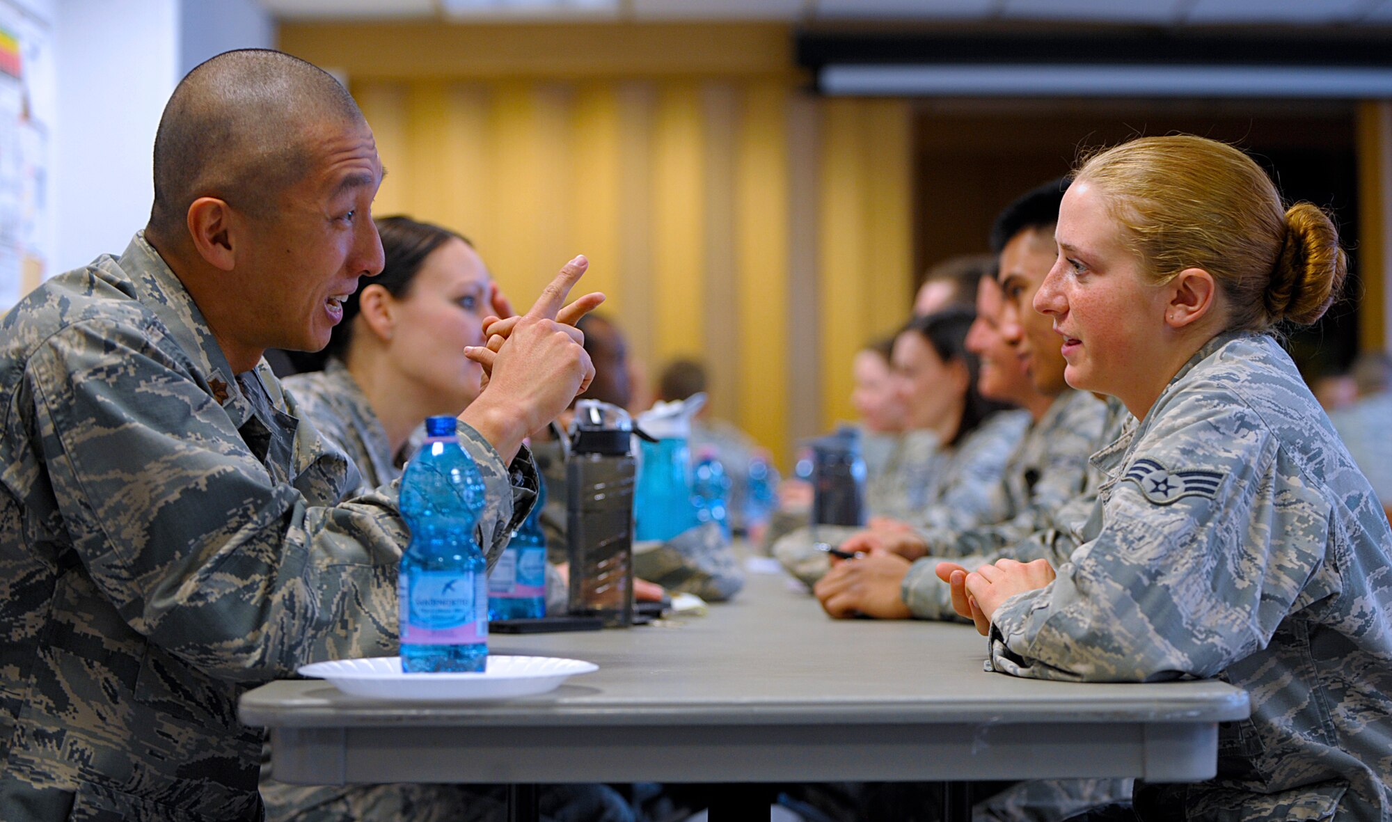 Maj. Brian Zajick, 9001st Air Reserve Squadron Air Force Academy air liaison officer, speaks to Senior Airman Nadine Peterson, 86th Security Forces Squadron armorer, during a speed mentoring session March 28, 2016, at Ramstein Air Base, Germany. Zajick said he volunteered to mentor because he believes it’s important for active-duty service members to have more than just active-duty mentors. (U.S. Air Force photo/Staff Sgt. Timothy Moore)