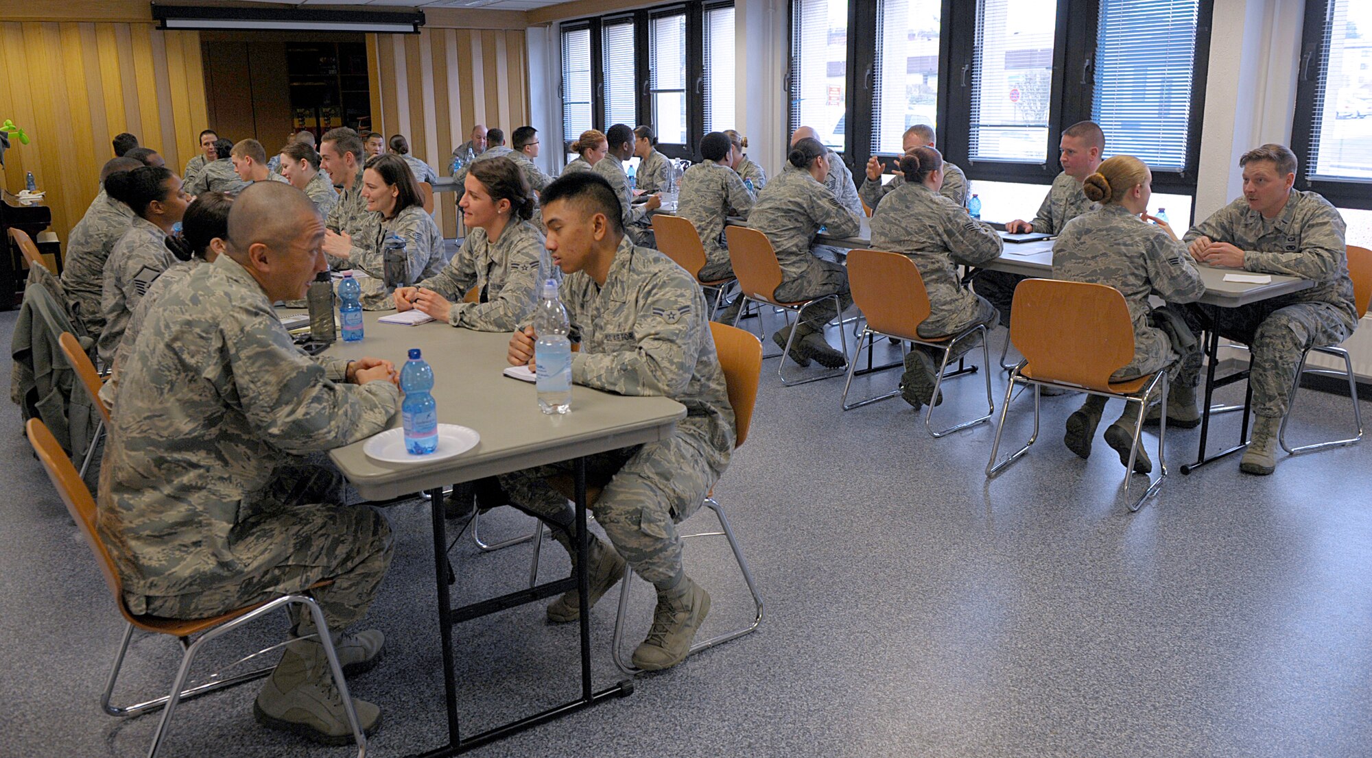Airmen participate in a speed mentoring session March 28, 2016, at Ramstein Air Base, Germany. Each mentoring session lasted only five minutes; however, Airmen were encouraged to get contact information for anyone they connected with so they could re-engage later. (U.S. Air Force photo/Staff Sgt. Timothy Moore)