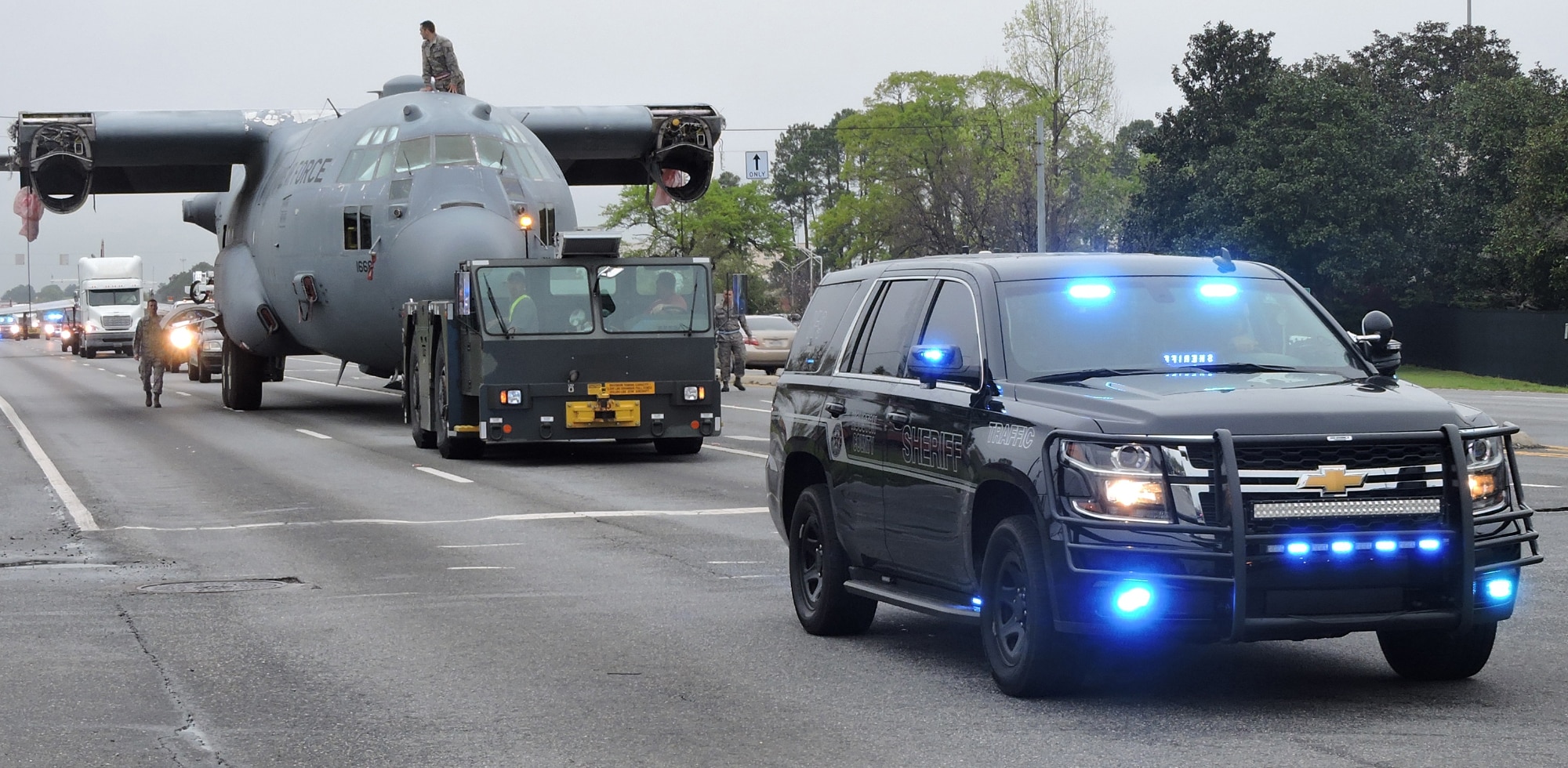 Houston County Sheriff’s Office personnel escort the C-130 trainer as it heads to its final destination, March 25, 2016. (U. S. Air Force photo by Roland Leach)
