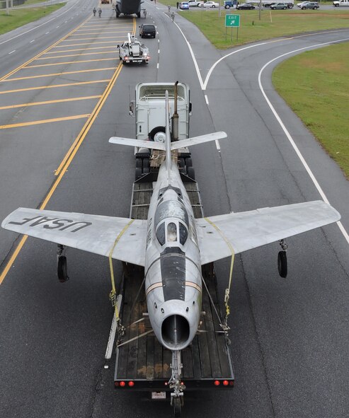 An Air National Guard F-84F Thunderstreak is towed down Ga. Highway 247 to the Museum of Aviation, March 25, 2016. (U. S. Air Force photo by Roland Leach)

