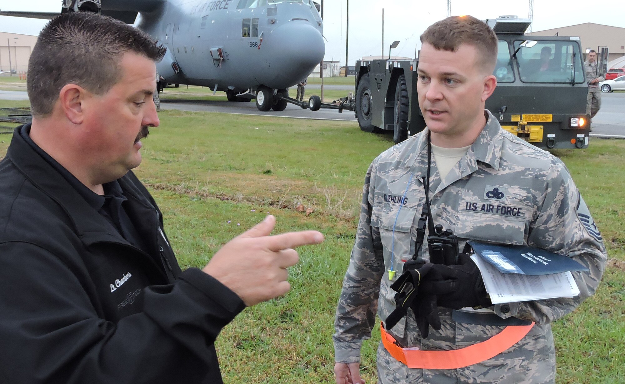 Master Sgt. David Rueling, 402nd Expeditionary Maintenance section chief, speaks with Lt. Clay Chambers of the Houston County Sheriff’s Office, March 25, 2016. (U. S. Air Force photo by Roland Leach)
