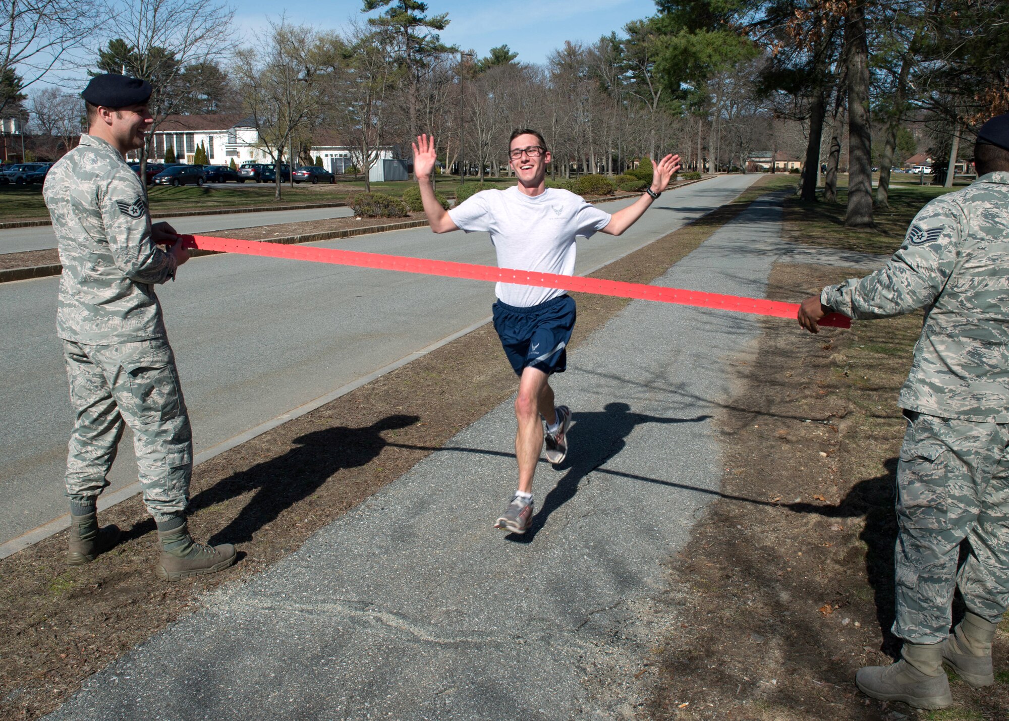 First Lt. Ian Gibson, a program manager assigned to the Battle Management Directorate, crosses the finish line during the Vietnam Veterans 5K on base March 30. Organizers collected more than 75 pounds of nonperishable food and more than 235 pounds of clothing to donate to local homeless veterans.  (U.S. Air Force photo by Jerry Saslav)