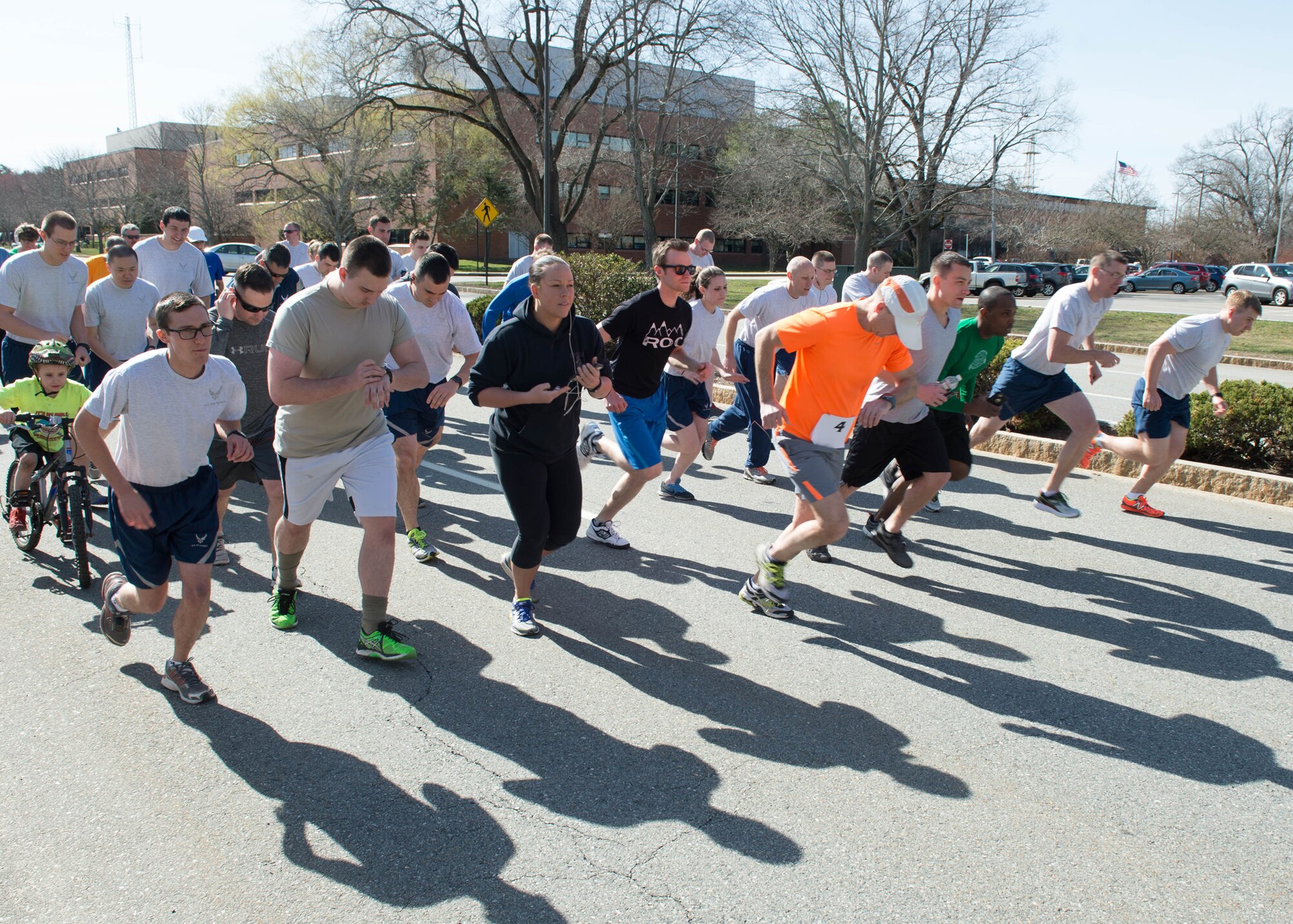 Nearly 50 members of the Hanscom community cross the starting line during the Vietnam Veterans 5K on base March 30. Organizers collected more than 75 pounds of nonperishable food and more than 235 pounds of clothing to donate to local homeless veterans. (U.S. Air Force photo by Jerry Saslav)