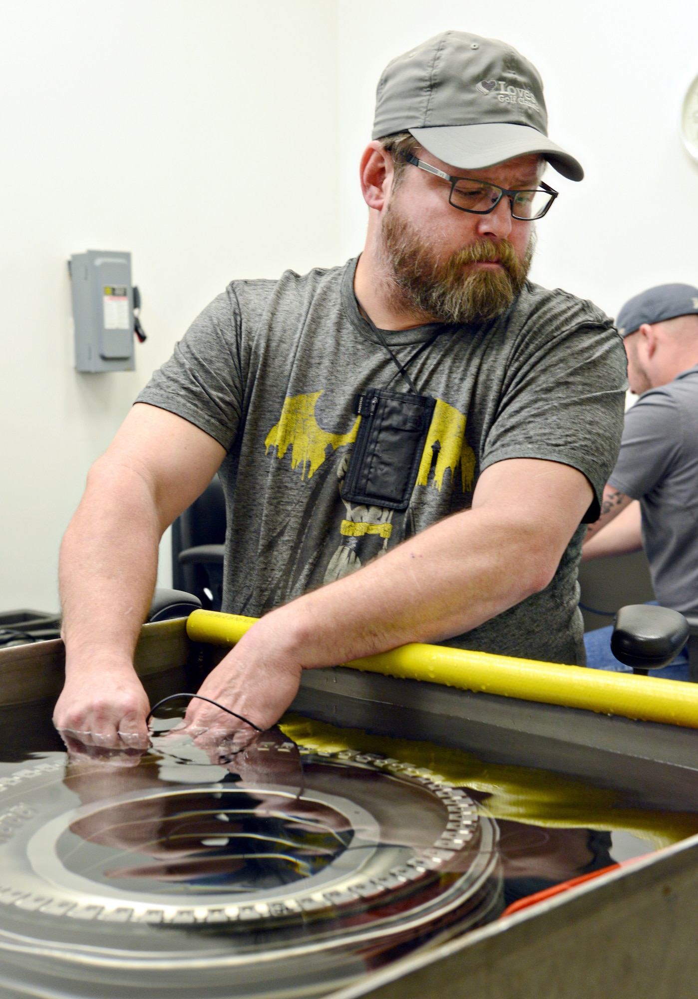 Owen Baker, an ultrasonic inspector with the 548th Propulsion Maintenance Squadron, performs an inspection on the scallops on a part of an F109 engine to check for minute cracks in the part that could compromise the integrity of the part. Mr. Baker is training to receive his Level 1 inspector certification, which is 400 hours of training. A Level 2 inspector will receive 1,200 more hours of training to become certified. (Air Force photo by Kelly White/Released)