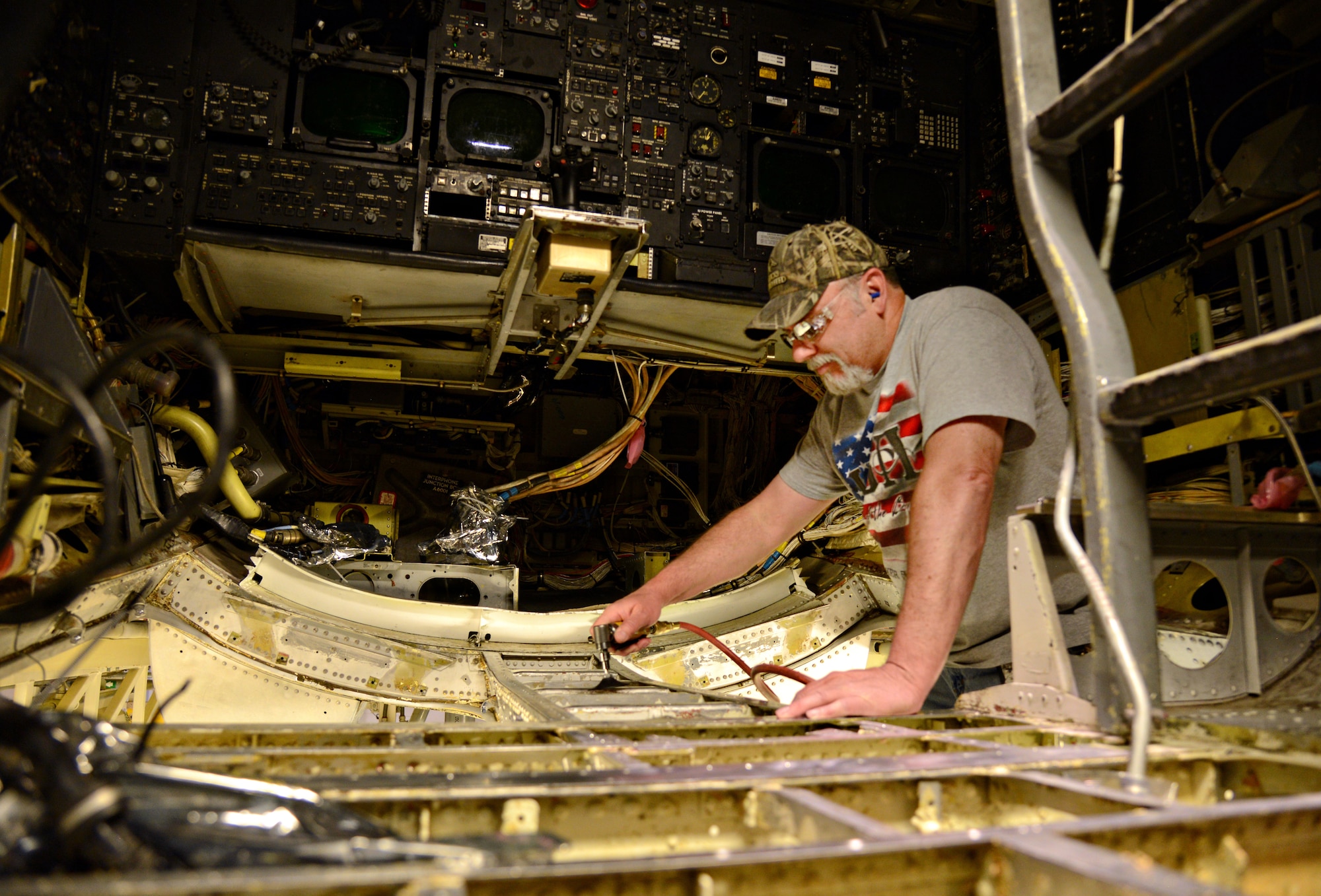 Tim Abshire, a sheet metal mechanic with the 565th Aircraft Maintenance Squadron, works on the structure of the fuselage of “Ghost Rider,” the B-52 Stratofortress which was pulled from the Boneyard at Davis-Monthan AFB, Ariz., and has made its way to Tinker to undergo programmed depot maintenance. (Air Force photo by Kelly White/Released)
