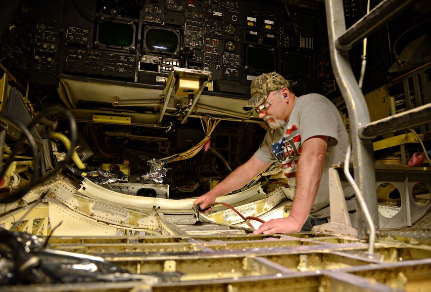 Tim Abshire, a sheet metal mechanic with the 565th Aircraft Maintenance Squadron, works on the structure of the fuselage of “Ghost Rider,” the B-52 Stratofortress which was pulled from the Boneyard at Davis-Monthan AFB, Ariz., and has made its way to Tinker to undergo programmed depot maintenance. (Air Force photo by Kelly White/Released)