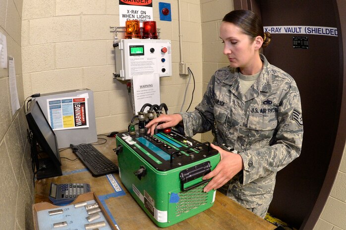 Staff Sgt. Cinnamon Kavlick, 388th Equipment Maintenance Squadron, adjusts the control box setting for a weld certification March 25 in the 388th EMS Nondestructive Inspection laboratory at Hill Air Force Base, Utah. The 388th EMS NDI lab recently converted its radiography equipment from a film-based to a digital output, which provides for excellent image sharpness, improving the probability of detecting flaws in aircraft engines, wings, and other components. (U.S. Air Force photo by Todd Cromar) 