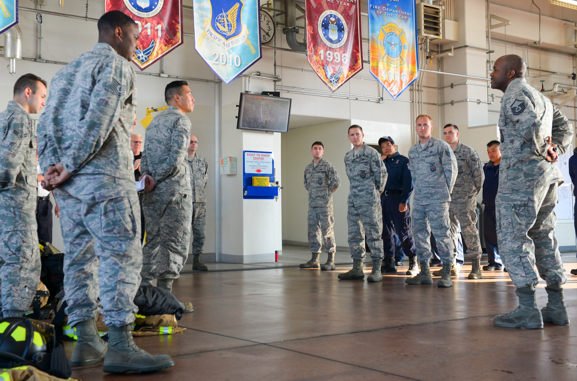 The 374th Civil Engineer Squadron fire and emergency services flight begins a new shift with roll call at Yokota Air Base, Japan, March 29, 2016. Every morning a fire and emergency services shift relieves the previous one from their 24 hours of duty. (U.S. Air Force photo by Airman 1st Class Elizabeth Baker/Released)