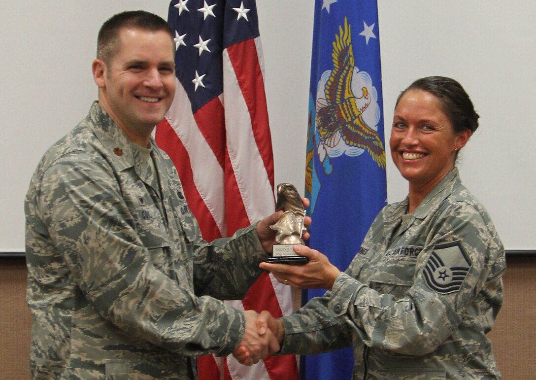 Major Coil, 88 Comptroller Squadron, presents MSgt Alyson Jones with the 2015 Band of Flight Annual Senior Noncommisioned  officer Award. Congratulations!
