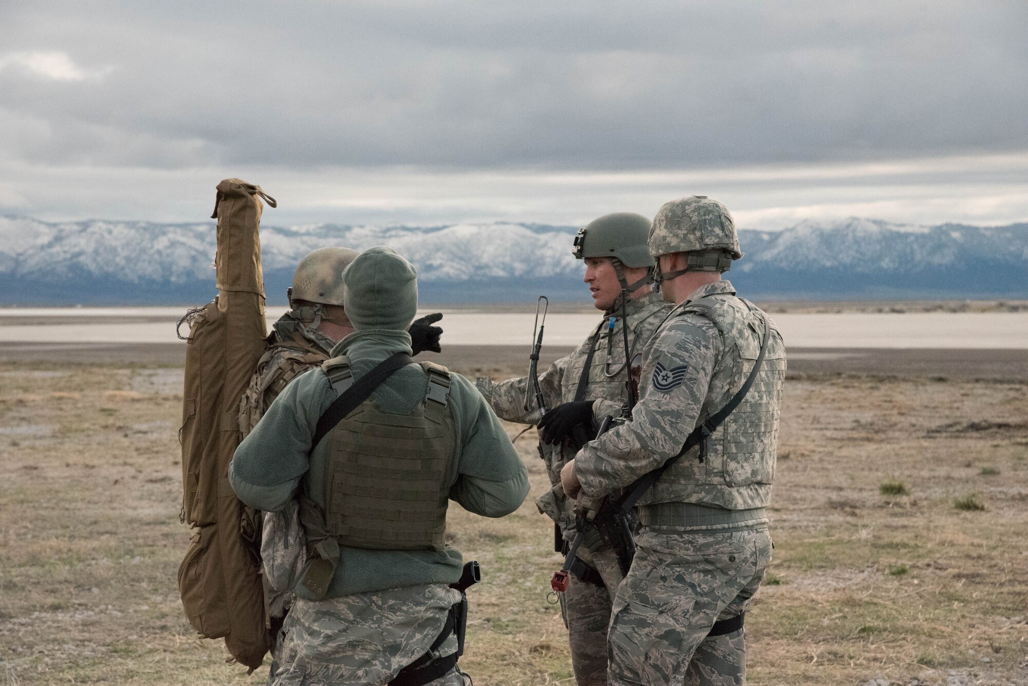 Airmen from the Kentucky Air National Guard’s 123rd Contingency Response Group discuss the security posture at Amedee Army Airfield, Calif., March 7, 2016. The 123rd CRG is working in conjunction with the U.S. Army’s 688th Rapid Port Opening Element and a team from the Defense Logistics Agency to operate Joint Task Force-Port Opening Sangala during a week-long exercise called Operation Lumberjack. The objective of the JTF-PO is to establish an aerial port of debarkation, provide initial distribution capability and set up warehousing for distribution beyond a forward node. (Kentucky Air National Guard photo by 1st Lt. James Killen)