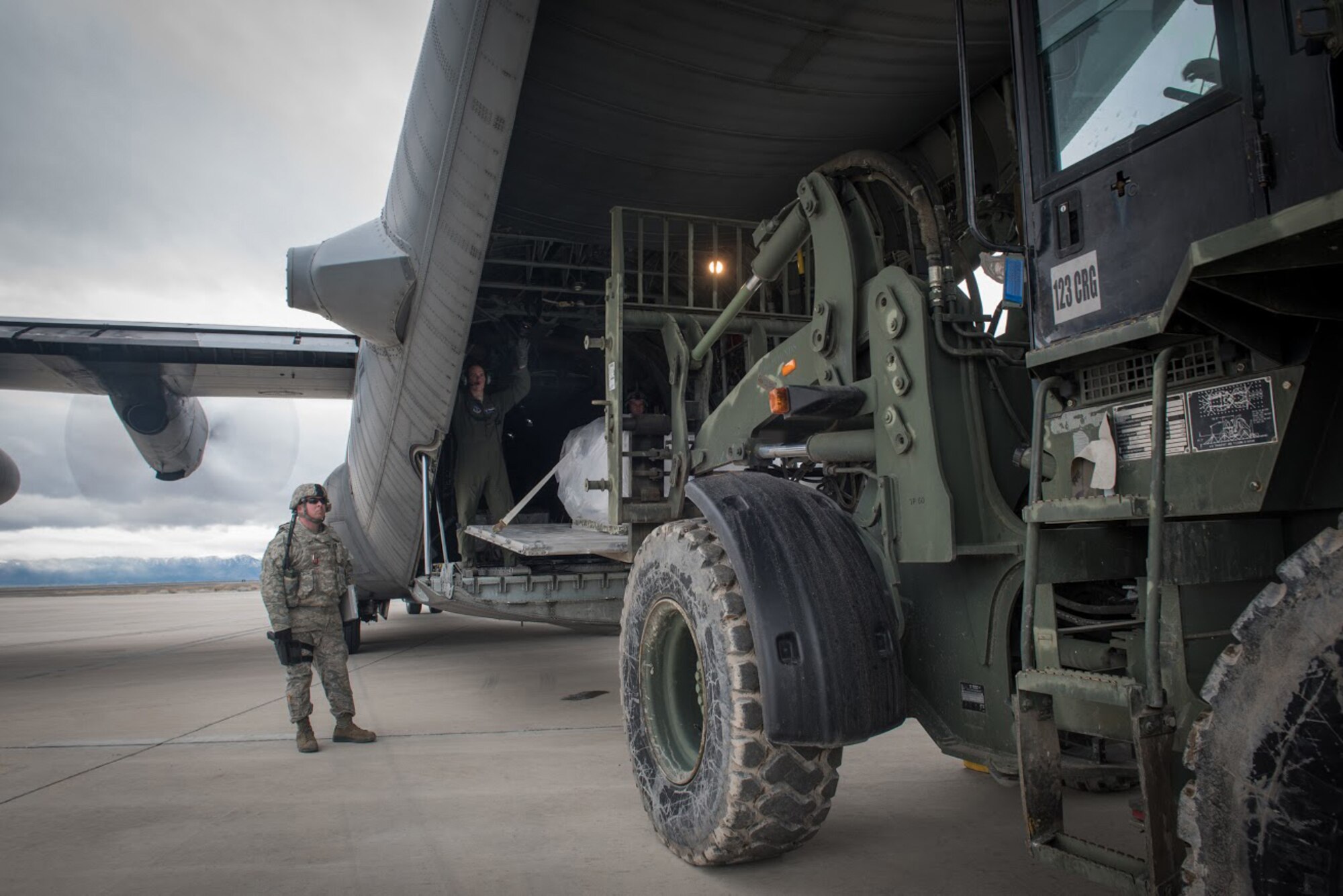 Aerial porters from the Kentucky Air National Guard’s 123rd Contingency Response Group unload cargo from a Wyoming Air National Guard C-130 at Amedee Army Airfield, Calif., on March 8, 2016. The 123rd CRG is working in conjunction with the U.S. Army’s 688th Rapid Port Opening Element and a team from the Defense Logistics Agency to operate Joint Task Force-Port Opening Sangala during a week-long exercise called Operation Lumberjack. The objective of the JTF-PO is to establish an aerial port of debarkation, provide initial distribution capability and set up warehousing for distribution beyond a forward node. (Kentucky Air National Guard photo by Master Sgt. Phil Speck)