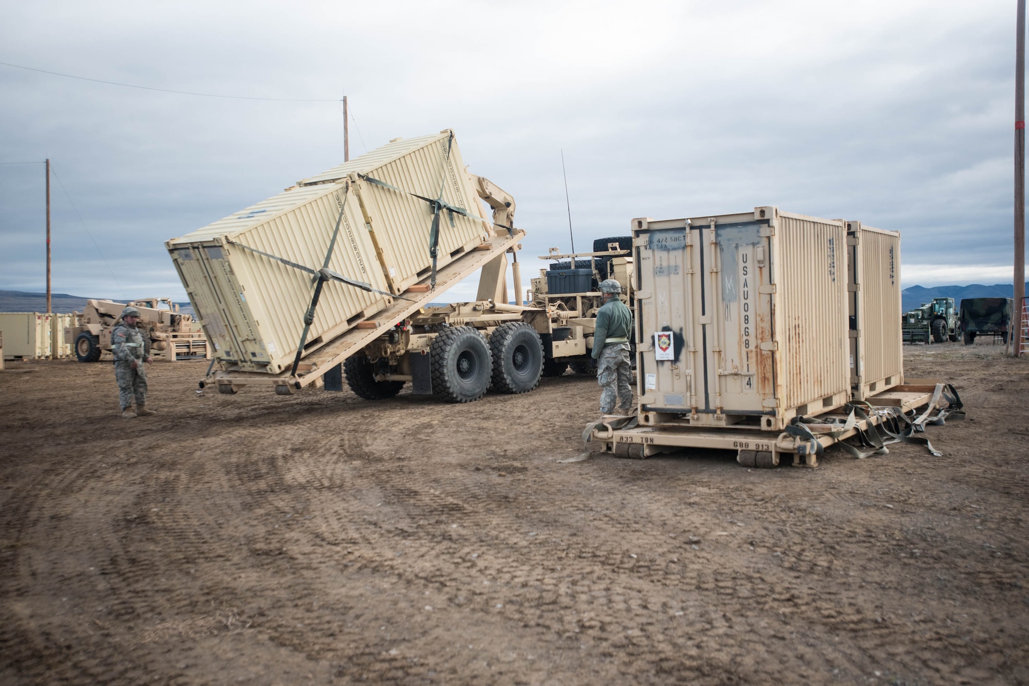 Soldiers from the U.S. Army’s 688th Rapid Port Opening Element use a Load Handling System to unload cargo at the forward operating node at Amedee Army Airfield, Calif., on March 9, 2016. The 688th RPOE is working in conjunction with the Kentucky Air National Guard’s 123rd Contingency Response Group and a team from the Defense Logistics Agency to operate Joint Task Force-Port Opening Sangala during a week-long exercise called Operation Lumberjack. The objective of the JTF-PO is to establish an aerial port of debarkation, provide initial distribution capability and set up warehousing for distribution beyond the forward node. (Kentucky Air National Guard photo by Master Sgt. Phil Speck)