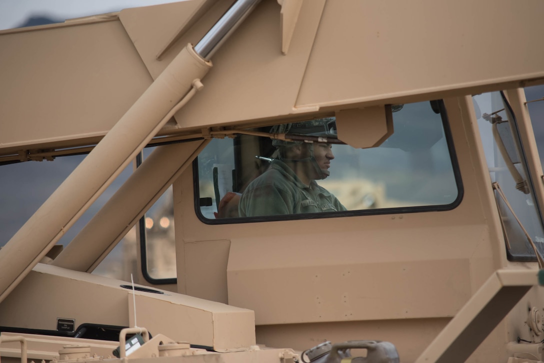 U.S. Army Pfc. Matthew Avery, an all-terrain forklift operator for the 688th Rapid Port Opening Element, moves cargo at the forward operating node at Amedee Army Airfield, Calif., on March 9, 2016. The 688th RPOE is working in conjunction with the Kentucky Air National Guard’s 123rd Contingency Response Group and a team from the Defense Logistics Agency to operate Joint Task Force-Port Opening Sangala during a week-long exercise called Operation Lumberjack. The objective of the JTF-PO is to establish an aerial port of debarkation, provide initial distribution capability and set up warehousing for distribution beyond the forward node. (Kentucky Air National Guard photo by Master Sgt. Phil Speck)