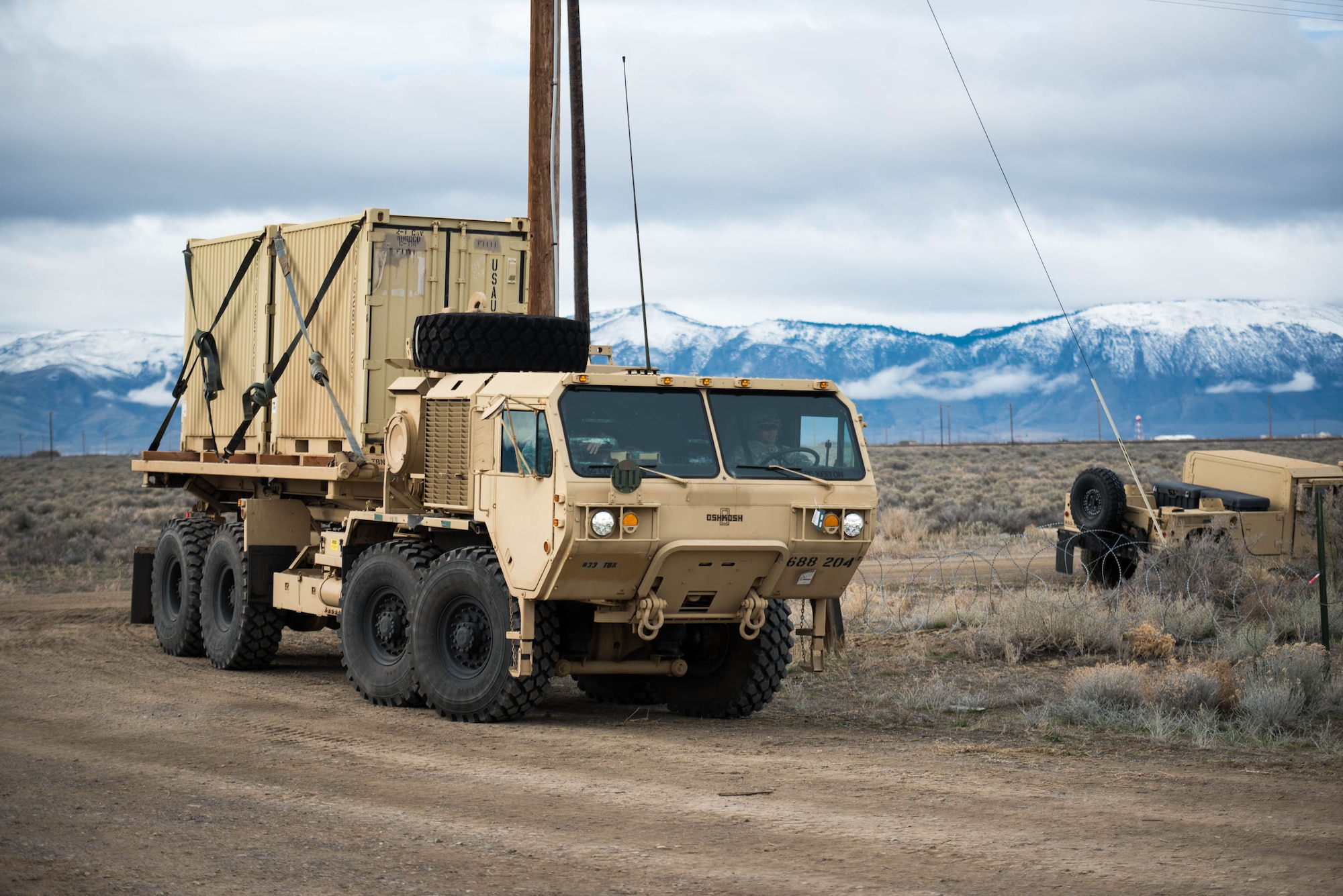 Soldiers from the U.S. Army’s 688th Rapid Port Opening Element drive a Load Handling System vehicle to the forward operating node at Amedee Army Airfield, Calif., to unload cargo March 9, 2016. The 688th RPOE is working in conjunction with the Kentucky Air National Guard’s 123rd Contingency Response Group and a team from the Defense Logistics Agency to operate Joint Task Force-Port Opening Sangala during a week-long exercise called Operation Lumberjack. The objective of the JTF-PO is to establish an aerial port of debarkation, provide initial distribution capability and set up warehousing for distribution beyond the forward node. (Kentucky Air National Guard photo by Master Sgt. Phil Speck)