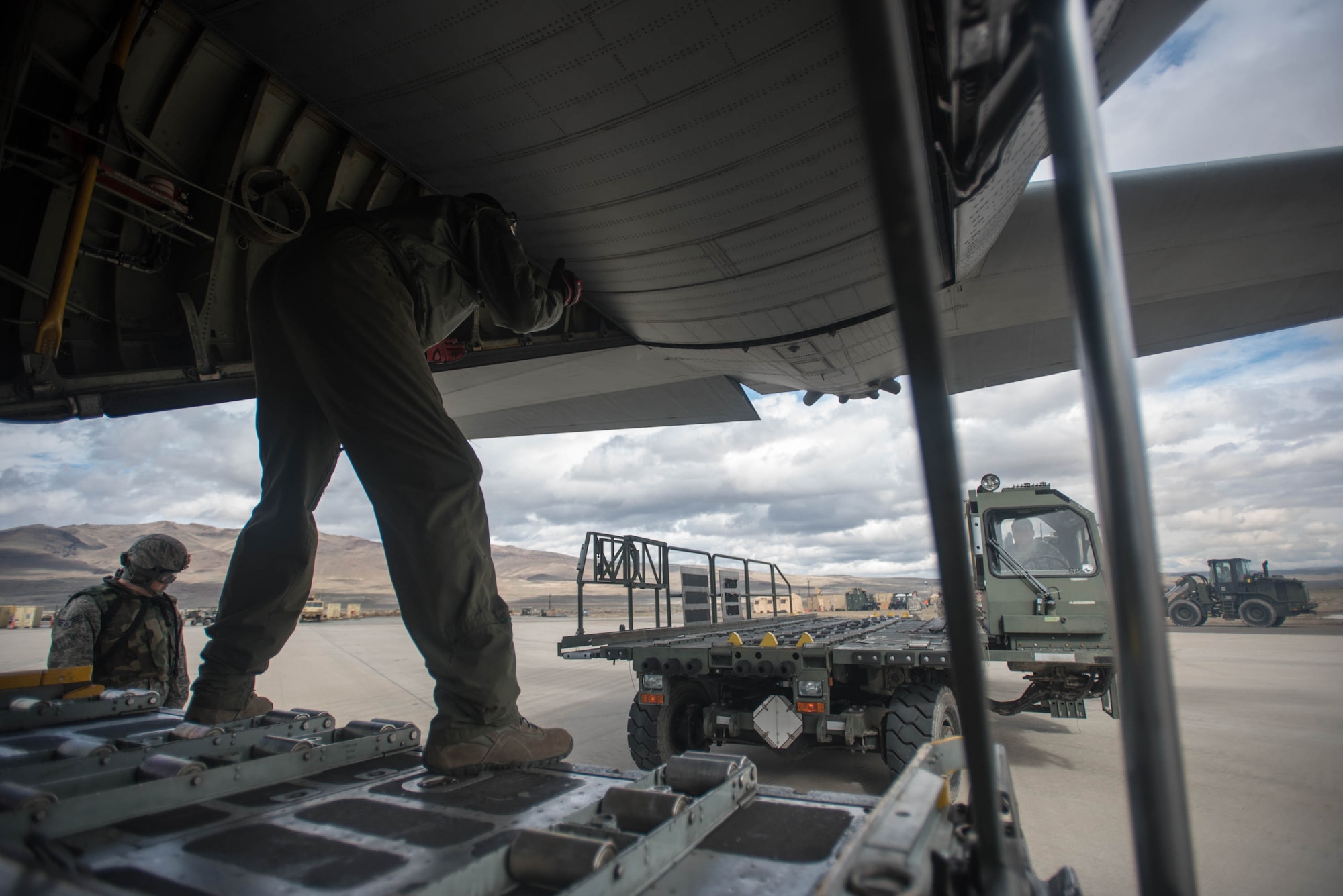 Aerial porters from the Kentucky Air National Guard’s 123rd Contingency Response Group use a Halvorsen Loader to off-load cargo from a New York Air National Guard C-130 at Amedee Army Airfield, Calif., during Operation Lumberjack on March 9, 2016. The 123rd CRG is working in conjunction with the U.S. Army’s 688th Rapid Port Opening Element and a team from the Defense Logistics Agency to operate Joint Task Force-Port Opening Sangala during the week-long exercise. The objective of the JTF-PO is to establish an aerial port of debarkation, provide initial distribution capability and set up warehousing for distribution beyond a forward node. (Kentucky Air National Guard photo by Master Sgt. Phil Speck)