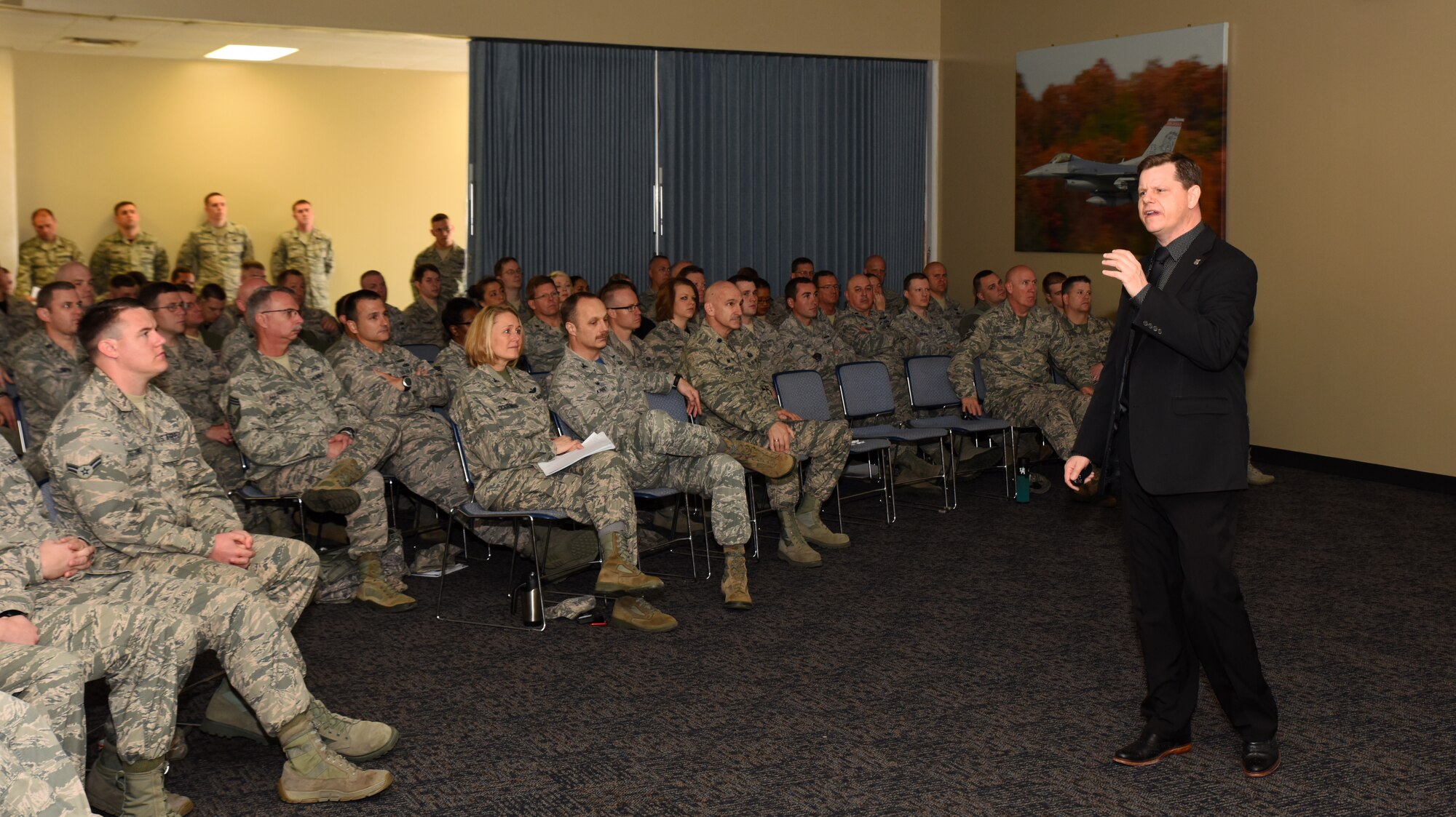Blain Miller, director of Mission Support of the 480th Intelligence, Surveillance and
Reconnaissance Wing, spoke to members of the 188th Wing March 5. Miller is also a
motivational speaker and life coach. He provided uplifting messages to 188th members
on resilience, member care and innovative methods of individual and group
motivation based on his experiences as a military leader and high school football
coach. (U.S. Air National Guard photo by Senior Airman Cody Martin/Released)