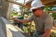 U.S. Air Force Staff Sgt. Kyle Gould, engineer, assigned to the 673rd Expeditionary Engineer Squadron, flattens a layer of cement to help build a classroom for the Jaena Norte Elementary School, in Capiz, Philippines, during Exercise Balikatan, March 29, 2016. The construction project is one of multiple HCAs taking place during this year's exercise, designed to improve the quality of life for the local populace and strengthen the bond between our two nations. Balikatan, which means 
