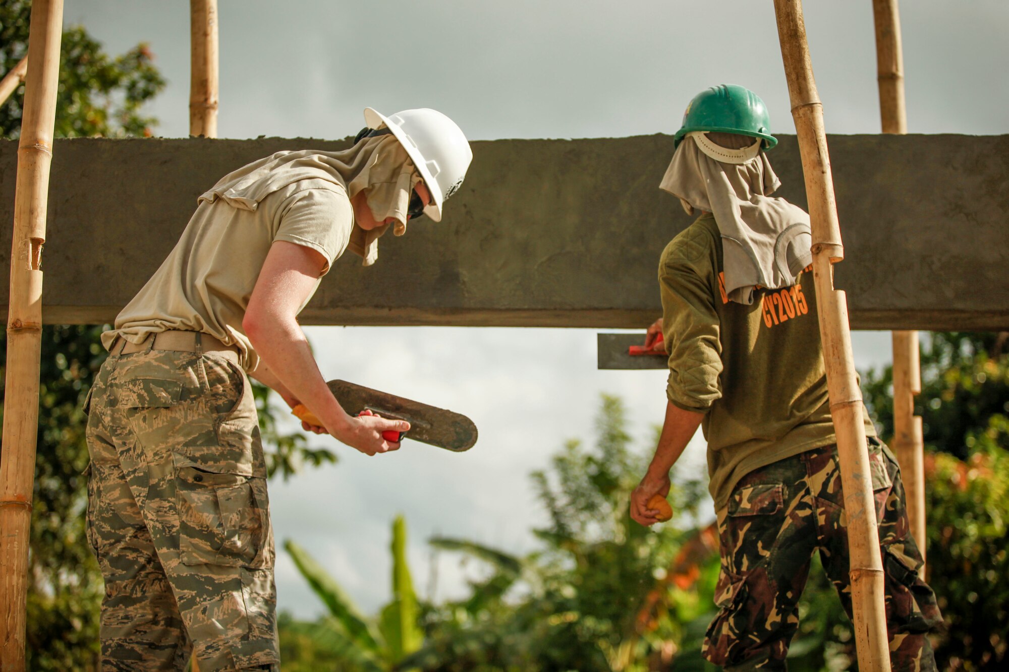 U.S. Air Force Airman 1st Class Ben Setchell, left, engineer, assigned to the 673rd Expeditionary Engineer Squadron, and Philippine army soldier Pvt. Rabe Eadao, right, engineer, assigned to the 552nd Engineer Construction Battalion, help build a classroom for the Jaena Norte Elementary School, in Capiz, Philippines, during Exercise Balikatan, March 29, 2016. The construction project is one of multiple HCAs taking place during this year's exercise, designed to improve the quality of life for the local populace and strengthen the bond between our two nations. Balikatan, which means "shoulder to shoulder" in Filipino, is an annual bilateral training exercise aimed at improving the ability of Philippine and U.S. military forces to work together during planning, contingency and humanitarian assistance and disaster relief operations. 
