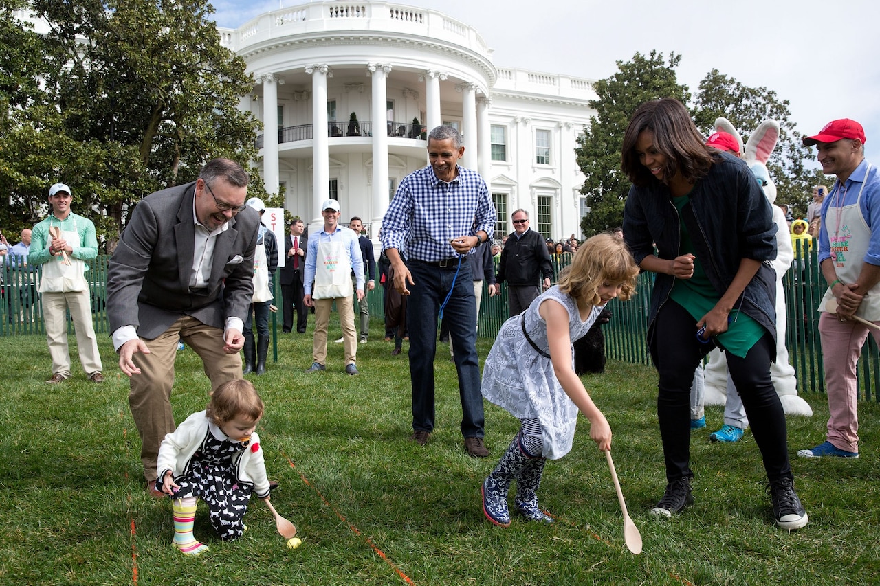 President Barack Obama and First Lady Michelle Obama cheer children on during the annual White House Easter Egg Hunt, March 28, 2016. Military children and families were among the 35,000 invited participants. White House photo by Pete Souza
