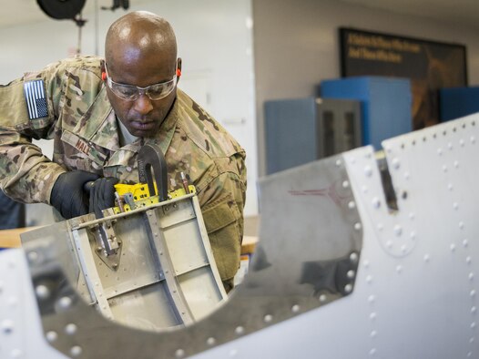 Tech. Sgt. Rodrick Hall, 919th Maintenance Squadron, replaces a broken piece of equipment off of a C-145 Skytruck at Duke Field, Fla., Feb. 25.  Hall is part of the 919th Special Operations Maintenance Group’s fabrication shop.  (U.S. Air Force photo/Tech. Sgt. Sam King)  