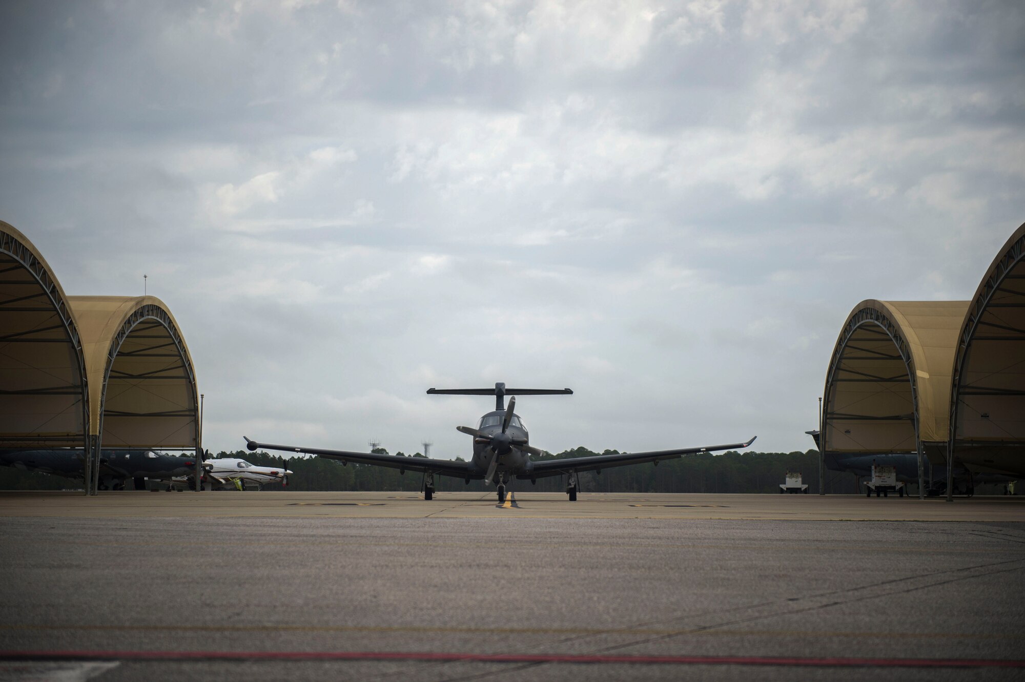 A U-28A aircraft taxies in after completing a mission March 31 at Hurlburt Field, Fla.  Part of the sortie was completion of aircraft mission qualification training by Staff Sgt. Kyle Cook, a tactical system operator with the 28th Intelligence Squadron.  The completion of that training pushed the squadron to its goal of full operational capability more than a year ahead of schedule.  (U.S. Air Force photo/Airman 1st Class Kai White)