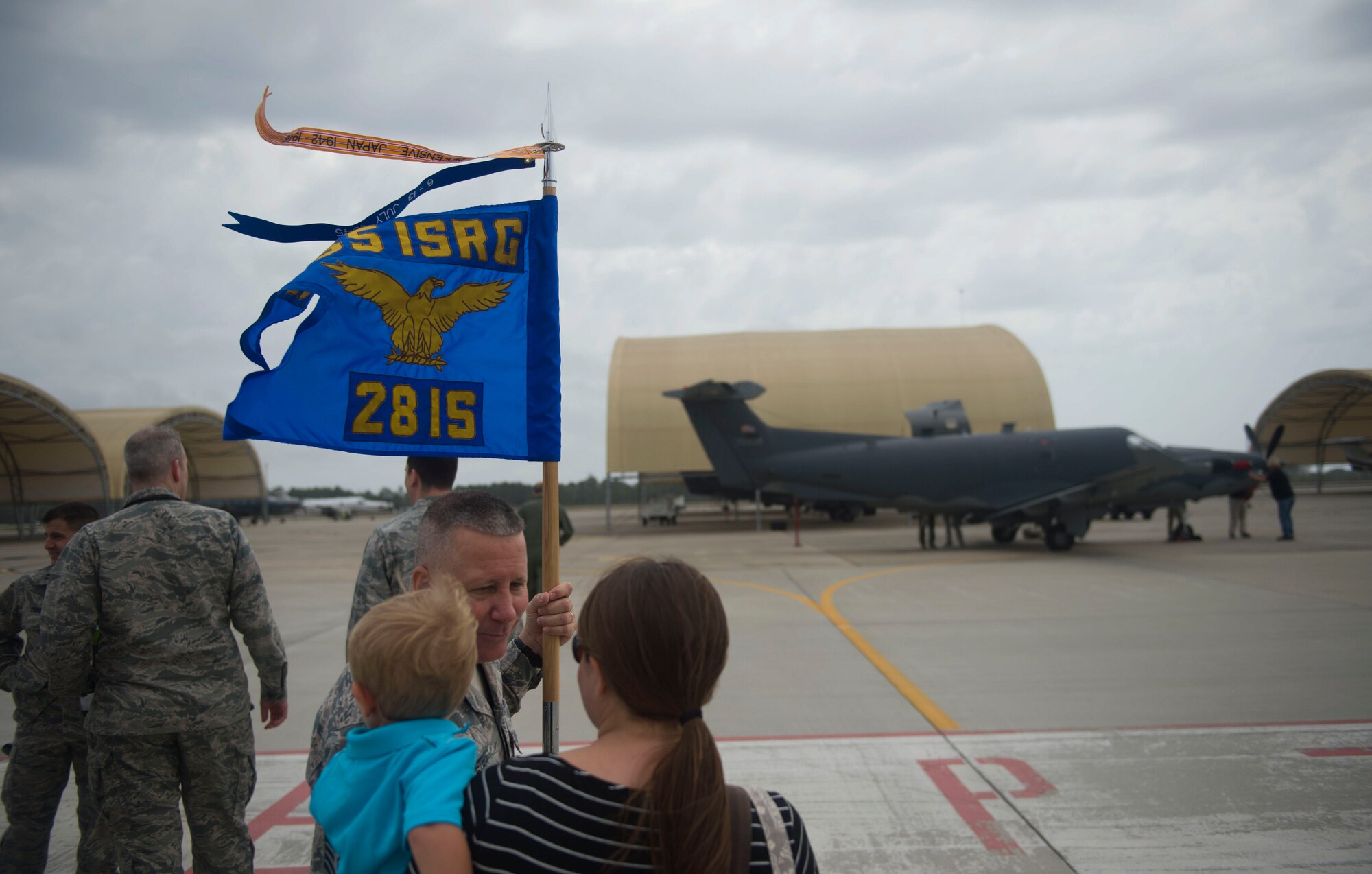 Members of the 28th Intelligence Squadron wait to congratulate Staff Sgt. Kyle Cook after his U-28 flight March 31 at Hurlburt Field, Fla.  Cook completed his aircraft mission qualification training with the sortie.  The completion of that training pushed the squadron to its goal of full operational capability more than a year ahead of schedule.  (U.S. Air Force photo/Airman 1st Class Kai White)