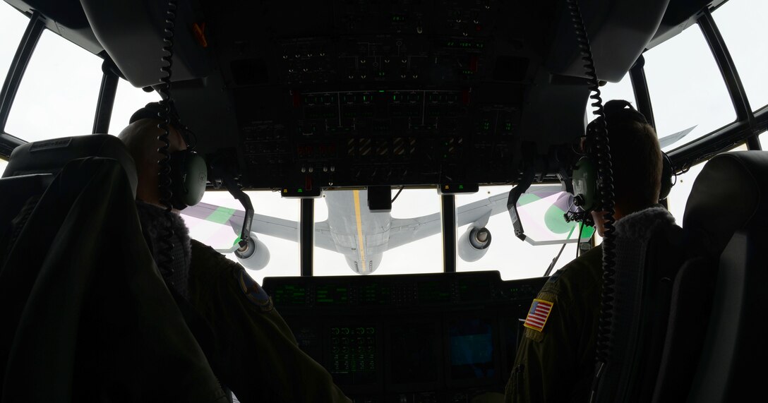 U.S. Air Force MC-130J Commando II pilots coordinate aerial refueling March 24, 2016. The MC-130J, assigned to RAF Mildenhall, England, performed an over water combat mission profile.  The mission illustrated the aircrew’s proficiency and the versatility of the aircraft. (U.S. Air Force photo by Senior Airman Justine Rho/Released)