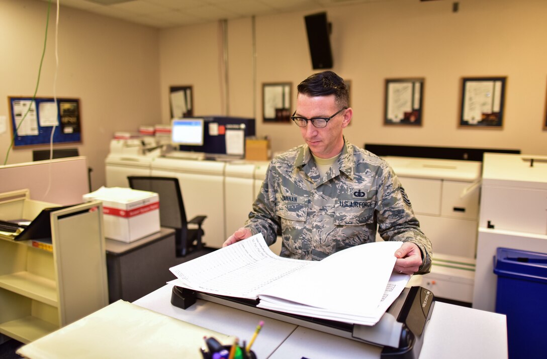 Technical Sgt. Matthew Dannan prepares a score for an upcoming
performance before sending it off to the conductor. He holds a Master's
Degree in Library Science and serves as the Chief Music Librarian for the
U.S. Air Force Band. (U.S. Air Force photo by Senior Master Sgt. Kevin
Burns/released)
