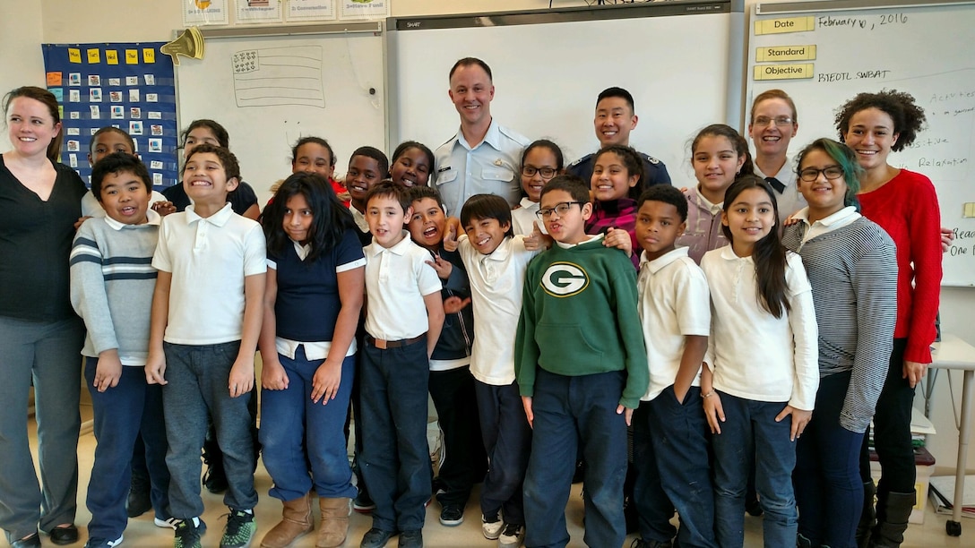 Master Sgts. Bradley Bennett,  Benjamin Park and Anne Baker visited
Powell Elementary School to share with the students how to perform the
national anthem of Germany for an upcoming performance for the German
Ambassador to the United States. The clinic was part of the Embassy Adoption
Program, a joint effort between the U.S. Air Force Band, Washington
Performing Arts and Washington, DC Public  Schools. (U.S. Air Force courtesy
photo/released)
