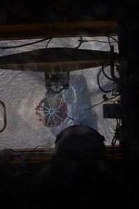 A U.S. Army CH-47 Chinook fills a Bambi Bucket from a lagoon April 1, 2016, near Tela, Honduras, to help extinguish a fire nearby. The Bambi Bucket is a device the Chinooks can use to drop up to 1,500 gallons of water on a fire during a single pass. (U.S. Air Force photo by Staff Sgt. Westin Warburton/ Released)