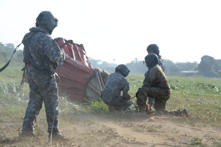 U.S. Army Soldiers assigned to the 1-228th Aviation Regiment connect a Bambi Bucket, used to fight fires, to a U.S. Army CH-47 Chinook March 31, 2016, Tela, Honduras, to respond to Honduran President Juan Orlando Hernandez’s request to help fight a forest fire. The Honduran Fire Department, Air Force and Army initiated the response to the fire, and the U.S. Service members from Joint Task Force-Bravo provided support to help prevent the fire from spreading to populated areas. (U.S. Air Force photo by Staff Sgt. Westin Warburton/ Released)