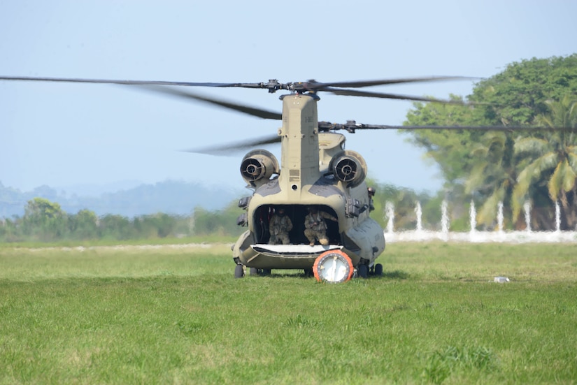 A U.S. Army CH-47 Chinook uses a Bambi Bucket to drop water on a fire March 31, 2016, near Tela, Honduras, at the request of Honduran President Juan Orlando Hernandez. The Chinooks were a part of aircraft from the 1-228th Aviation Regiment to support the Honduran Fire Department, Air Force and Army in the firefighting efforts. (U.S. Air Force photo by Staff Sgt. Westin Warburton/ Released)