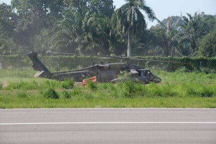A U.S. Army UH-60 Black Hawk with the 1-228th Aviation Regiment prepares to take off with a Bambi Bucket March 31, 2016, Tela, Honduras, to respond to a request from Honduran President Juan Orlando Hernandez for support in extinguishing a forest fire near Tela. The Honduran Fire Department, Air Force and Army worked with U.S. air assets from Joint Task Force-Bravo at Soto Cano Air Base, Honduras, to control and extinguish the fire. (U.S. Air Force photo by Staff Sgt. Westin Warburton/ Released)