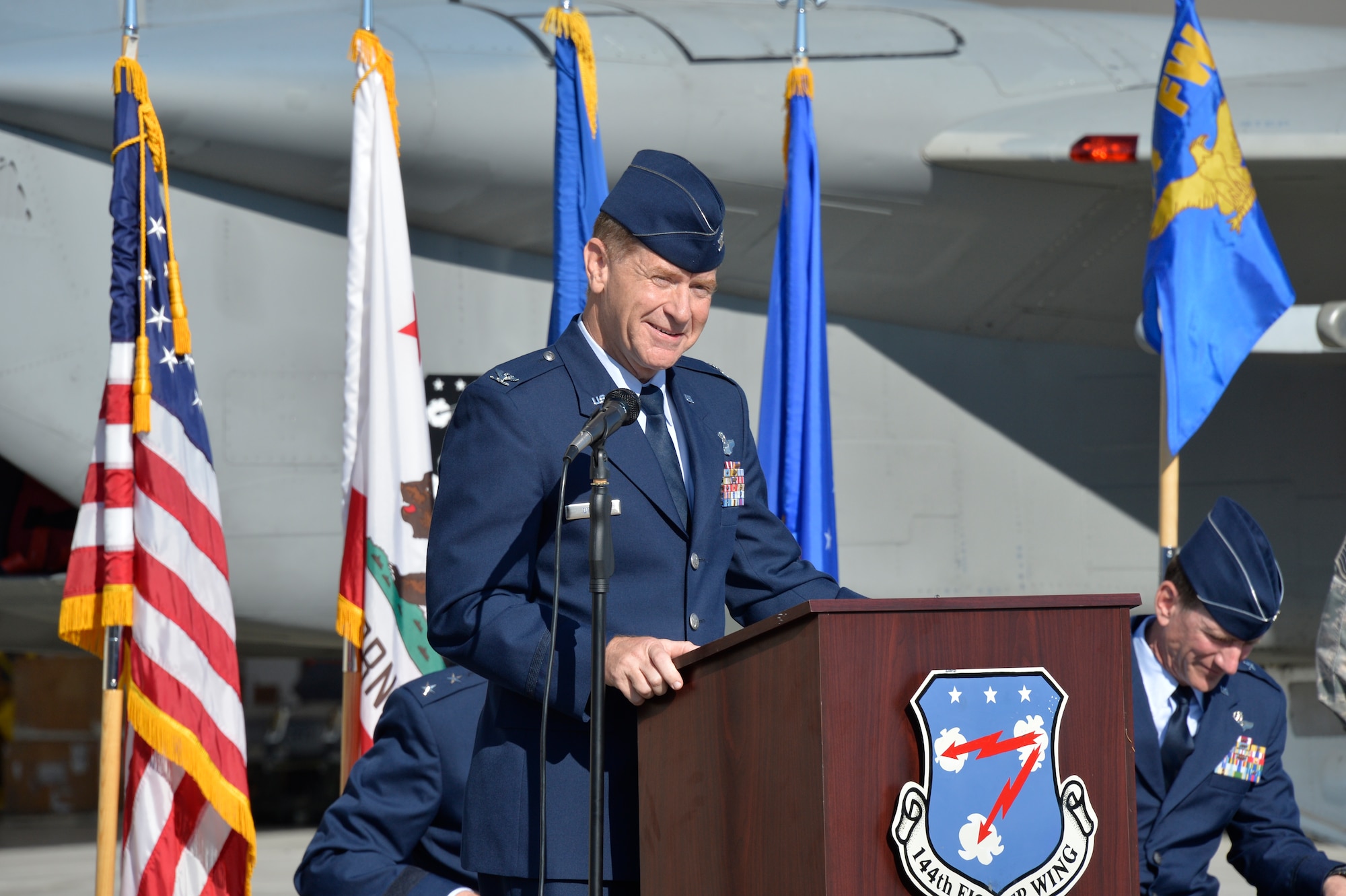 Col. Reed Drake, incoming 144th Fighter Wing commander, speaks to family, distinguished guests and members of the 144th Fighter Wing during a change of command ceremony at the Fresno Air National Guard Base April 2 , 2016. The change of command ceremony is a visible means of passing the reins of command from the departing commander to the new commander. (U.S. Air National Guard photo by Tech. Sgt. Charles Vaughn)