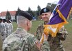 Brig. Gen. Arlan DeBlieck, commanding general of the 7th Mission Support Command, hands the unit colors to Col. John Novak, incoming commander of the 361st Civil Affairs Brigade during the brigade's change of command ceremony Sunday, April 3, 2016 at Daenner Kaserne in Kaiserslautern, Germany. 