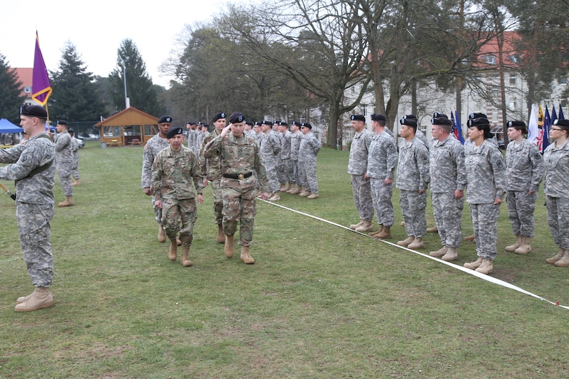 Brig. Gen. Arlan DeBlieck, commanding general of the 7th Mission Support Command (saluting), Col. Miguel Castellanos, outgoing commander of the 361st Civil Affairs Brigade, (left, front) and Col. John Novak, incoming commander of the 361st Civil Affairs Brigade (back, right) walk the line of troops during the 361st change of command ceremony Sunday, April 3, 2016 at Daenner Kaserne in Kaiserslautern, Germany. Lt. Col. Wayne Mingo, executive officer for the 361st accompanies them.