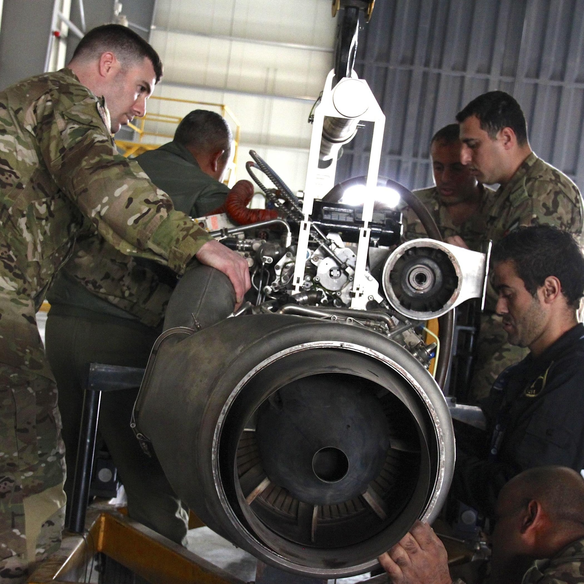 Combat Aviation Advisors help partner nation mechanics with aircraft engine maintenance during a deployed mission in March.  A CAA deployment sends a small team of Airmen to assess, advise, train, and assist friendly and allied forces with their own airpower resources.  Duke Field is the home of the only two CAA squadrons in the Air Force, the active-duty 6th Special Operations Squadron and the Reserve 711th SOS.  (Courtesy photo)