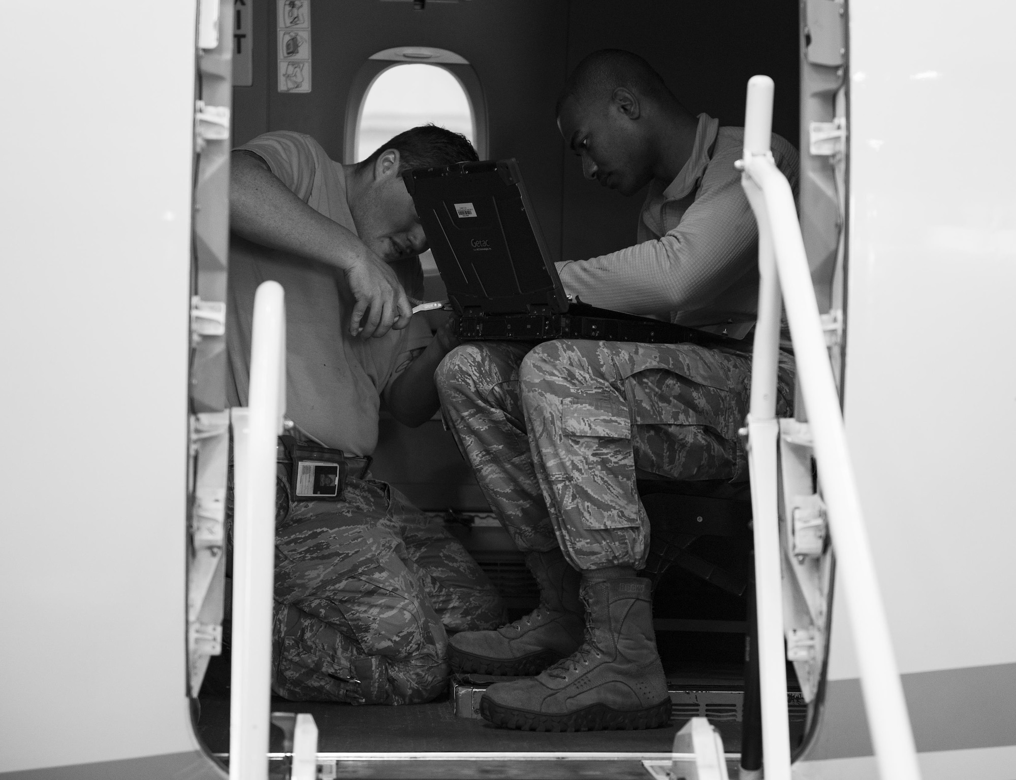Members of the 592nd Special Operations Maintenance Group, work on a part from the C-146 Wolfhound March 31 at Duke Field, Fla. The 592nd SOMXS and the 919th Special Operations Aircraft Maintenance Squadron assigned a dedicated crew chief and assistant crew chief to each of the aircraft at Duke Field. Each aircraft has an active-duty and reserve crew chief assigned to it. (U.S. Air Force photo/Tech. Sgt. Jasmin Taylor)