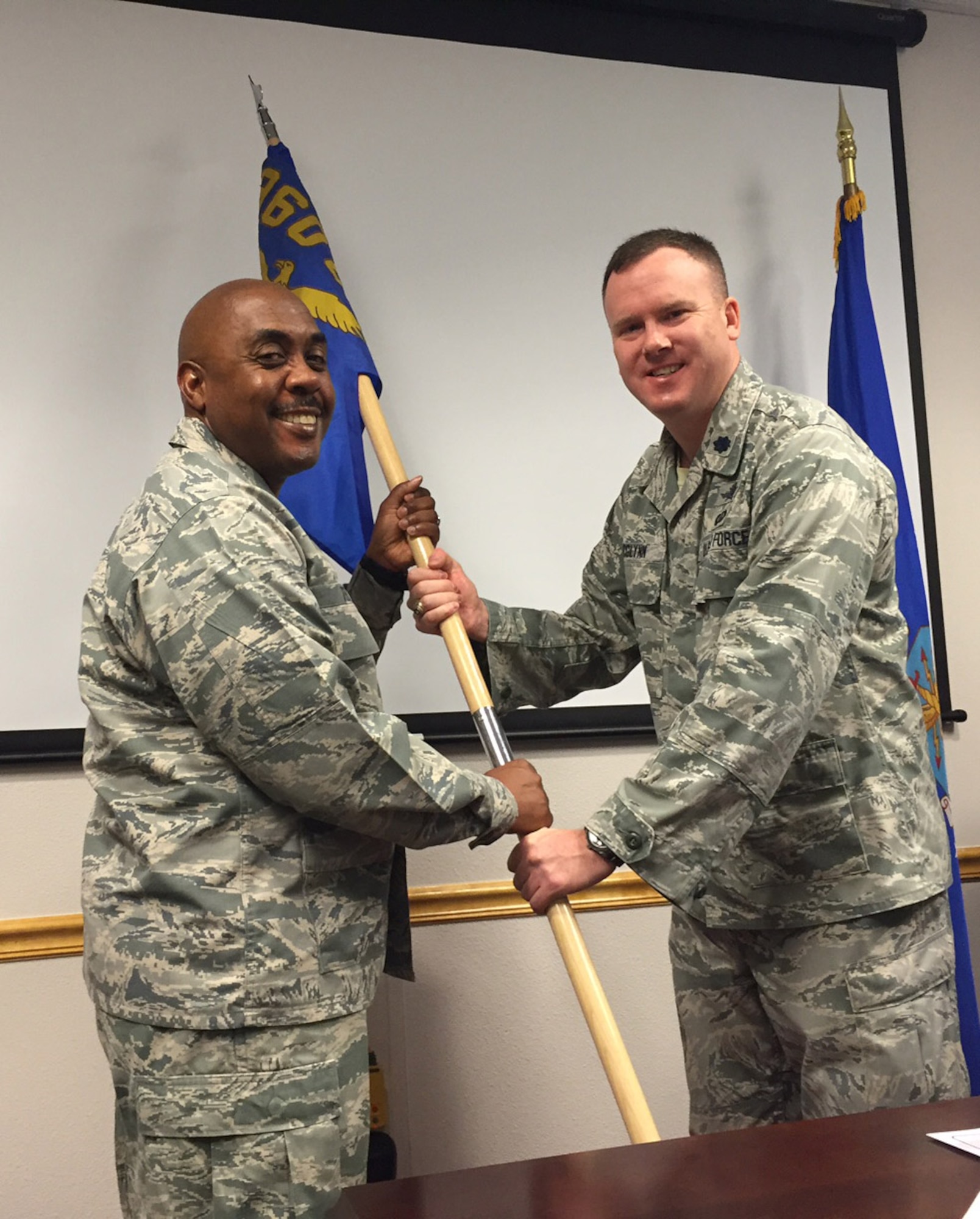 Lt. Col Samuel McGlynn accepts the 960th Cyberspace Operations Group Detachment 2 guidon from Col. Lloyd Terry, Jr., 960th CYOG commander, during an activation ceremony at the 2016 Commander's Forum at Joint Base San Antonio-Medina Annex, Mar. 23. McGlynn assumed command of the detachment, which will be located at Scott Air Force Base, Ill. (U.S. Air Force photo/Senior Airman Cesar Zayasnazario)
