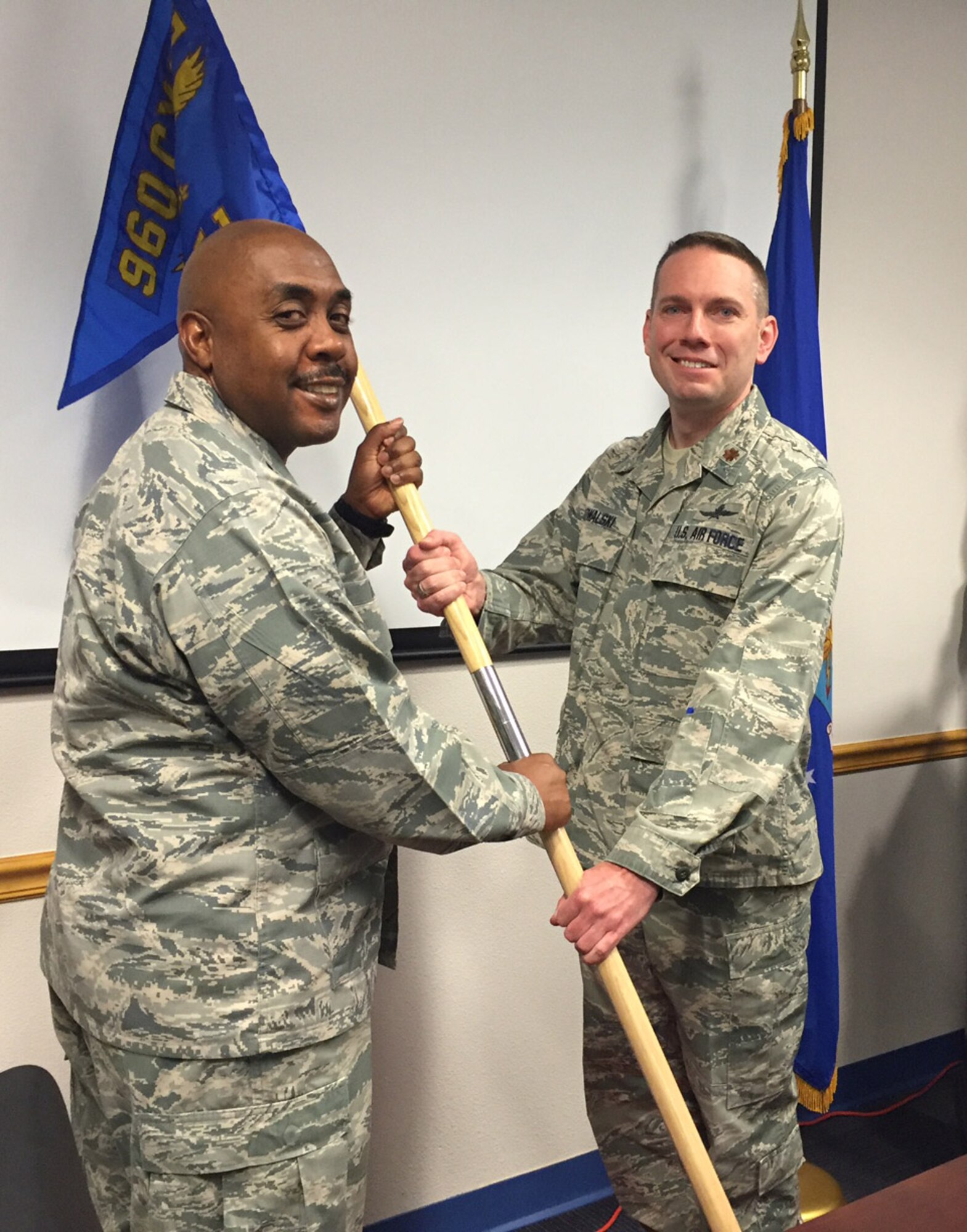 Maj. Stephen Kowalski accepts the 960th Cyberspace Operations Group Detachment 1 guidon from Col. Lloyd Terry, Jr., 960th CYOG commander, during an activation ceremony at the 2016 Commander's Forum at Joint Base San Antonio-Medina Annex, Mar. 23. Kowalski assumed command of the detachment, which will be located at Maxwell Air Force Base, Ala. (U.S. Air Force photo/Senior Airman Cesar Zayasnazario)
