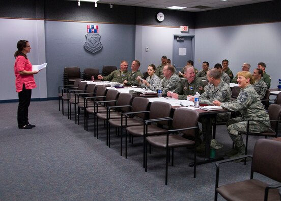 446th Airlift Wing senior leaders attend a Green Dot briefing at the 446th Airlift Wing headquarters auditorium April 3rd, 2016. The training, which focuses on prevention of interpersonal violence events among Airmen and their families, is scheduled to be delivered to the rest of the wing in the upcoming months. (U.S. Air Force Reserve photo by Staff Sgt. Madelyn McCullough)