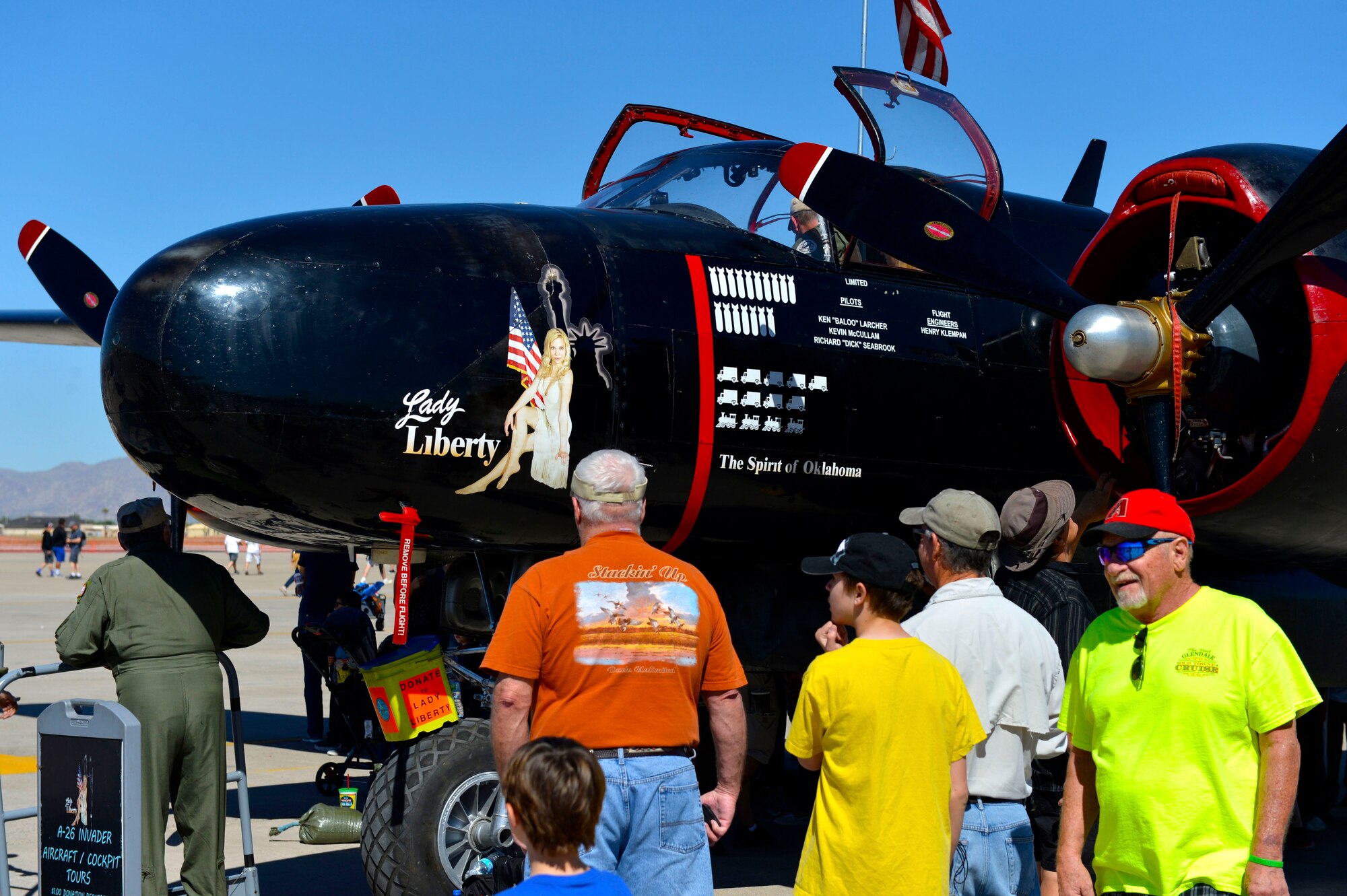 Airshow visitors admire an A-26 Invader at the Luke Air Force Base air show, 75 Years of Airpower Apr. 2, 2016.  The Invader is a twin-engine light bomber aircraft built during World War II.  (U.S. Air Force photo by Senior Airman James Hensley)