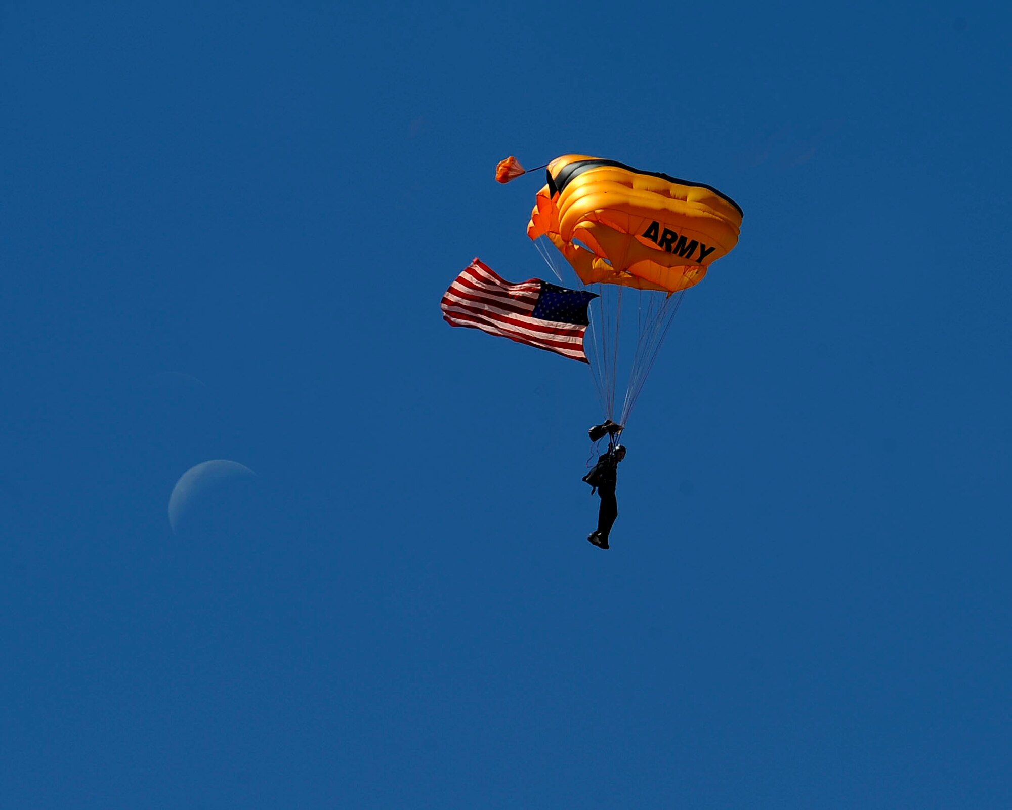 A member of the U.S. Army's Golden Knights descends on Luke Air Force Base Apr. 3, 2016.  The Golden Knights were the opening act for the Luke Air Force Base air show, 75 Years of Airpower.  (U.S. Air Force photo by Airman 1st Class Pedro Mota)