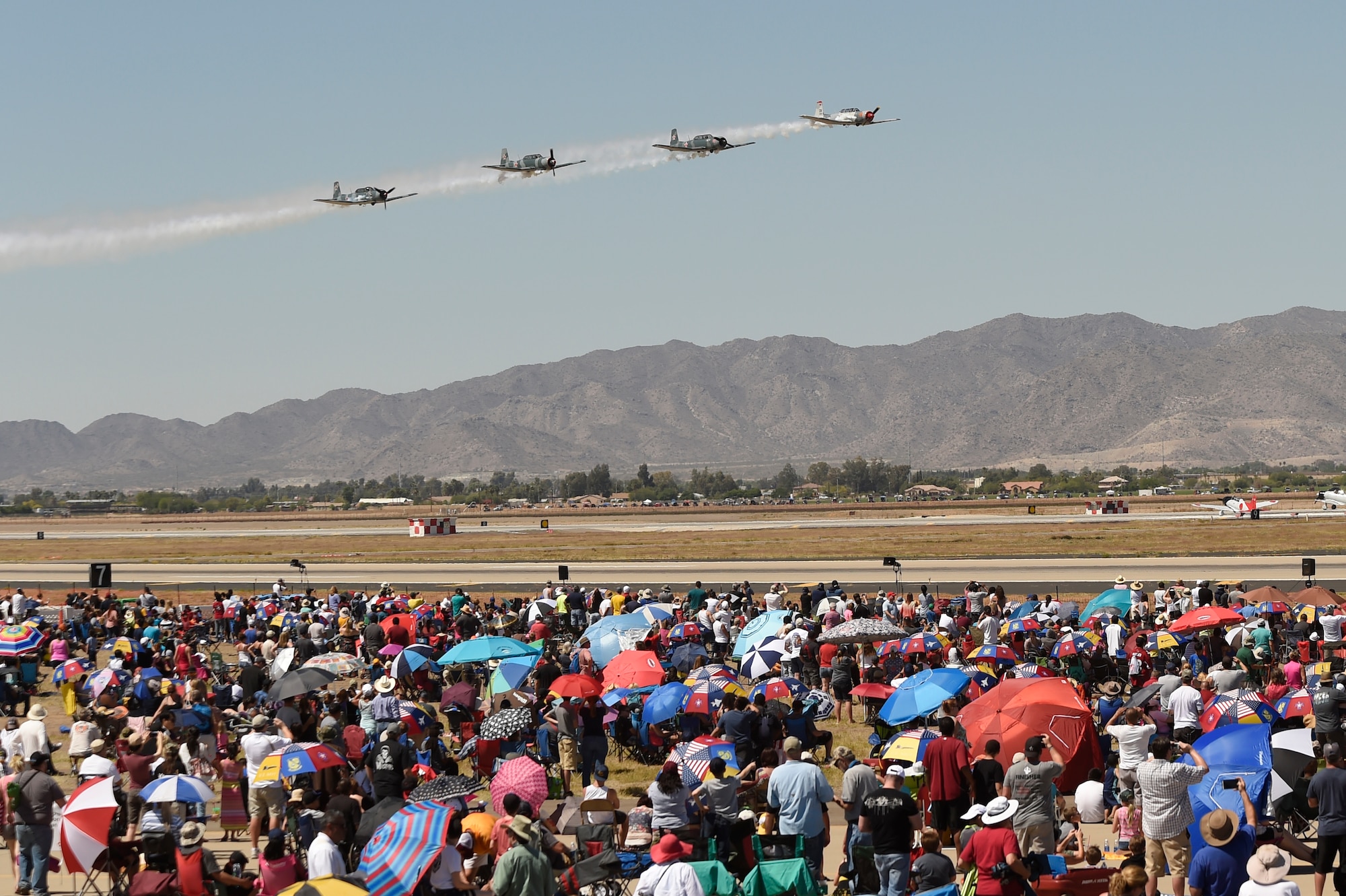 Members of the Desert Rats aerial demonstration team fly over the flight line at Luke Air Force Base during the 75 Years of Airpower air show Apr. 3, 2016.  (U.S. Air Force photo by Staff Sgt Staci Miller)