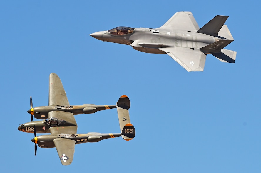 A P-38 Lightning flies on the wing of the F-35A Lightning II Joint Strike Fighter Apr. 3, 2016 during the Luke Air Force Base air show, 75 Years of Airpower.  (U.S. Air Force photo by Staff Sgt Staci Miller)