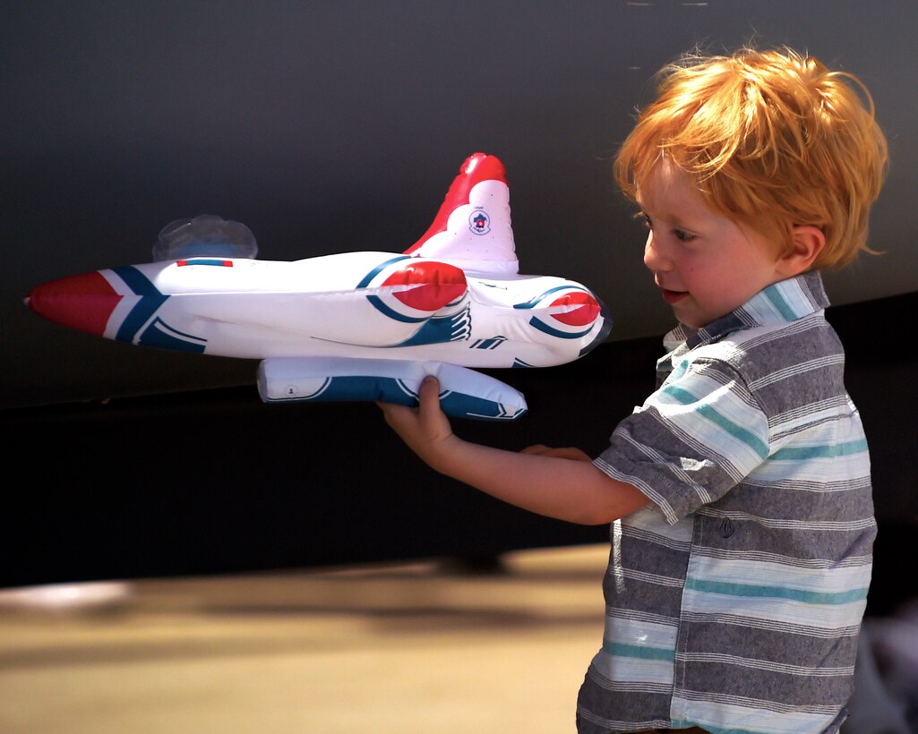 A young boy flies his Thunderbird at the Luke Air Force Base air show, 75 Years of Airpower Apr. 3, 2016.  (U.S. Air Force photo by Staff Sgt Staci Miller)