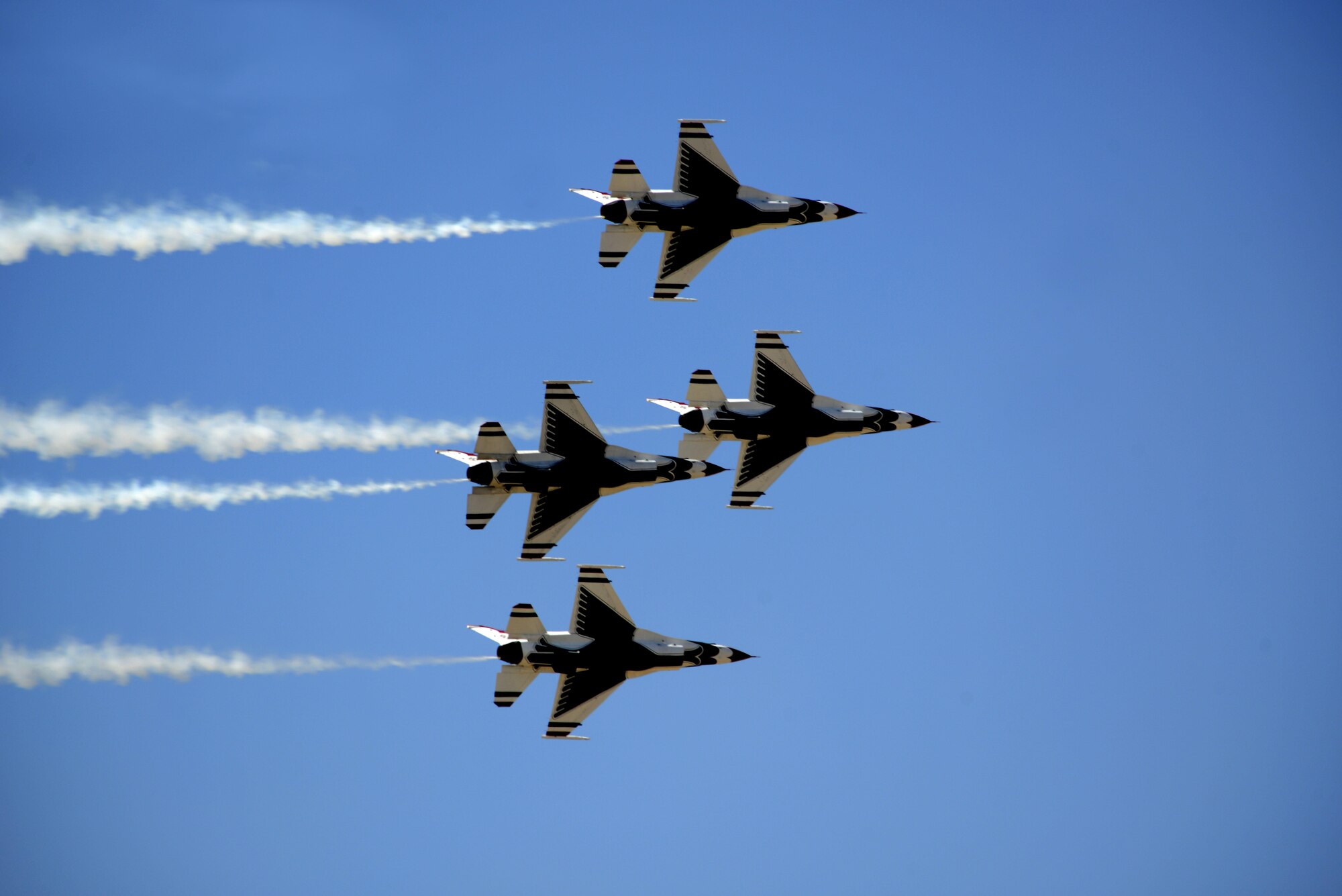 The U.S. Air Force Thunderbirds fly overhead at Luke Air Force  Base, 75 Years of Airpower.  The team performs precision aerial maneuvers to exhibit the capabilities of the modern high performance aircraft to audiences throughout the world.   (U.S. Air Force photo by Senior Airman Devante Williams)