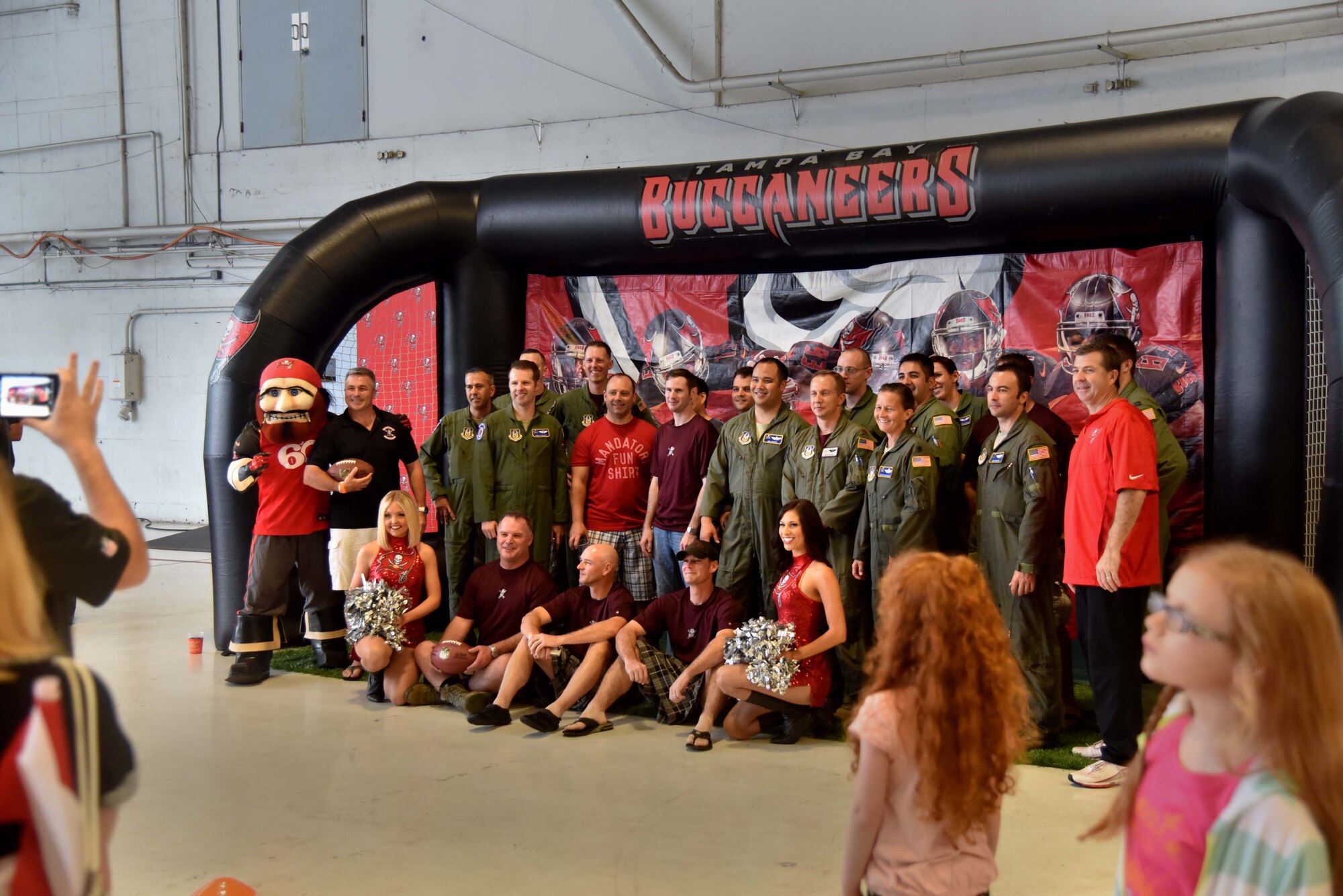 Members of the 63rd Air Refueling Squadron pose for a photo during Family day Apr. 2, 2016 at MacDill Air Force Base, Fla.  Family day is a wing event where families can interact with other military personnel and build upon relationships. (U.S. Air Force photo by Senior Airman Xavier Lockley)